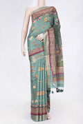 Green Dual Tone Tussar Saree with Printed design on the body and Zari Border displayed on a mannequin