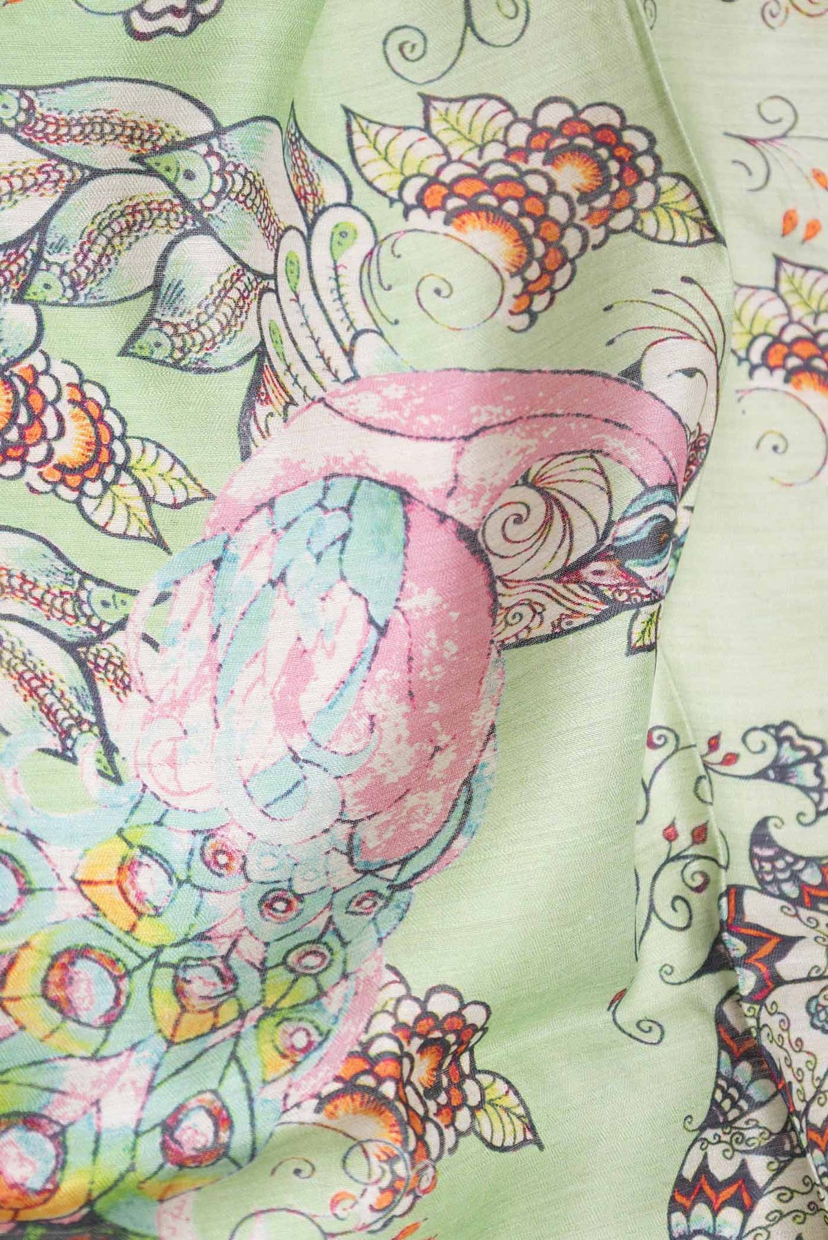 Close up of Green Dual Tone Tussar Saree with Printed design on the body and Zari Border displaying folds