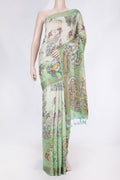 Green Dual Tone Tussar Saree with Printed design on the body and Zari Border displayed on a mannequin