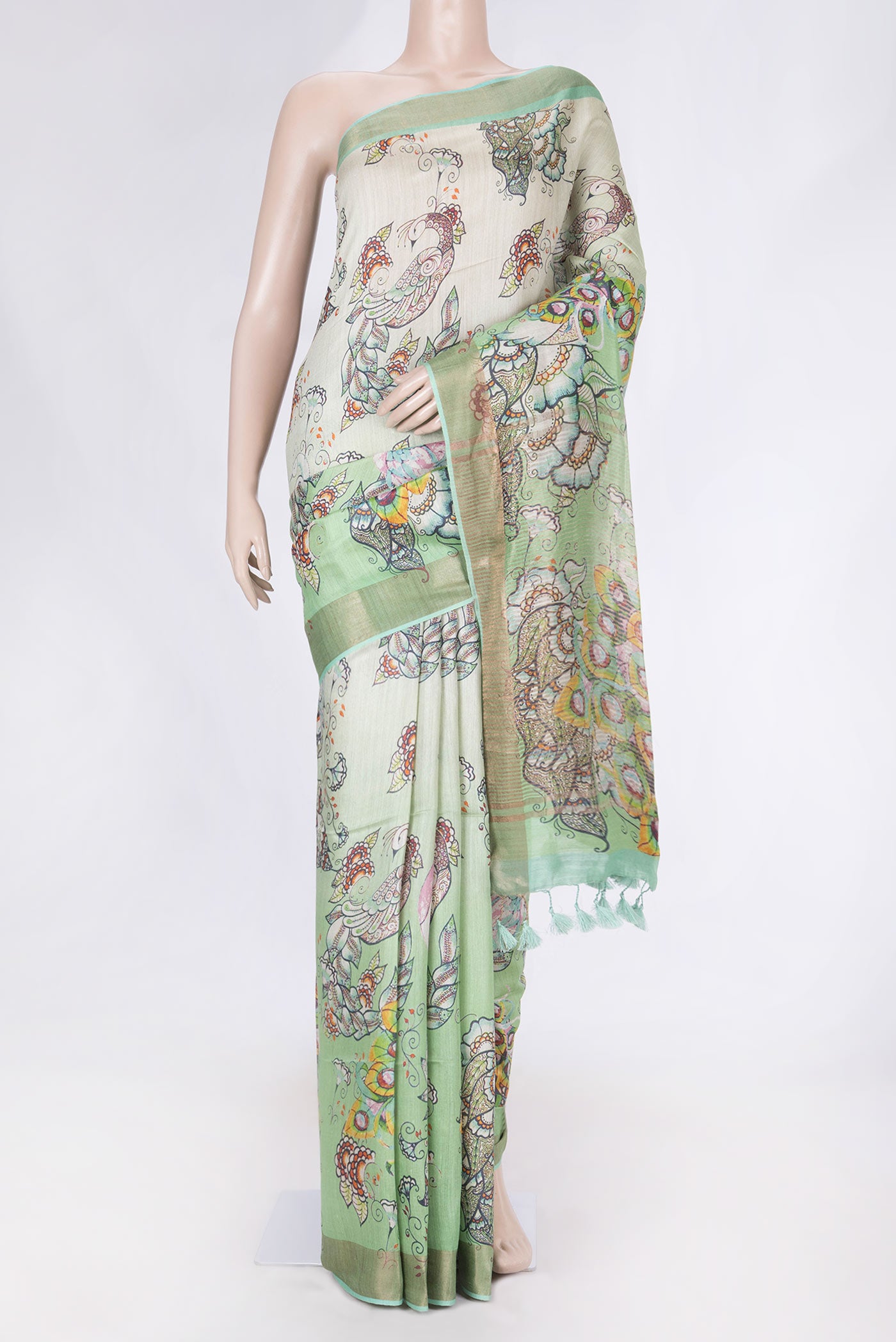 Green Dual Tone Tussar Saree with Printed design on the body and Zari Border displayed on a mannequin