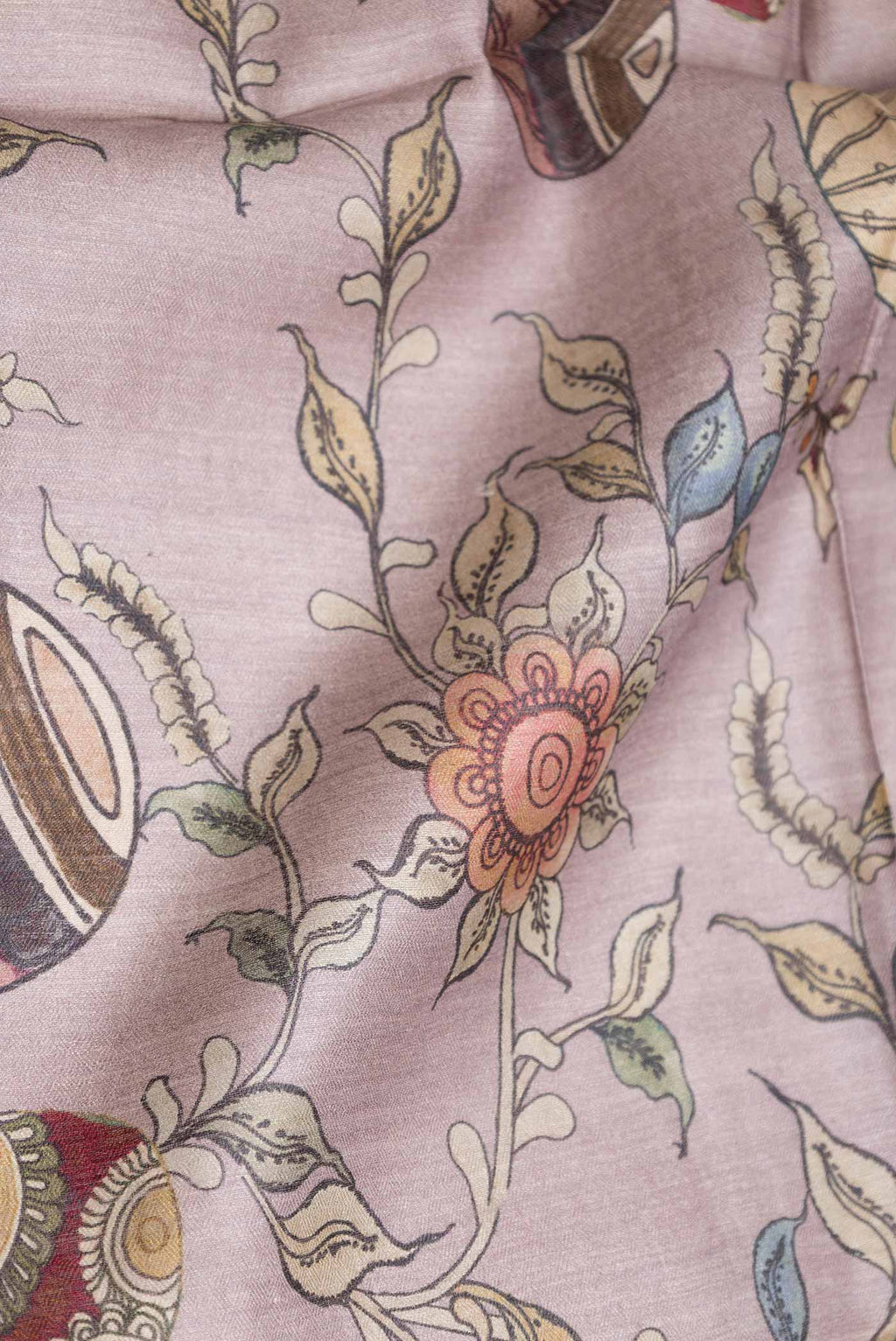 Close up of Grey Tussar Saree with Printed design on the body and Zari Border displaying folds