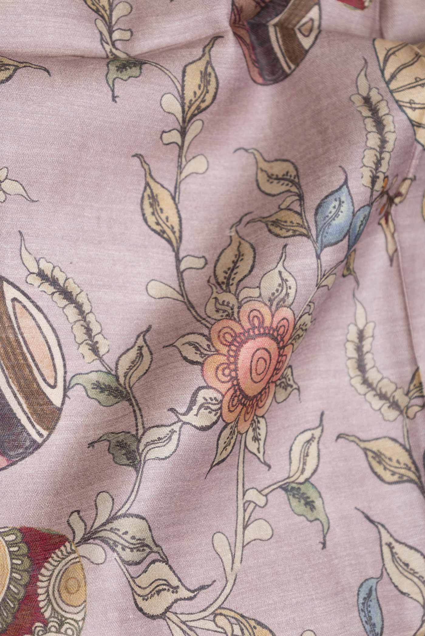 Close up of Grey Tussar Saree with Printed design on the body and Zari Border displaying folds