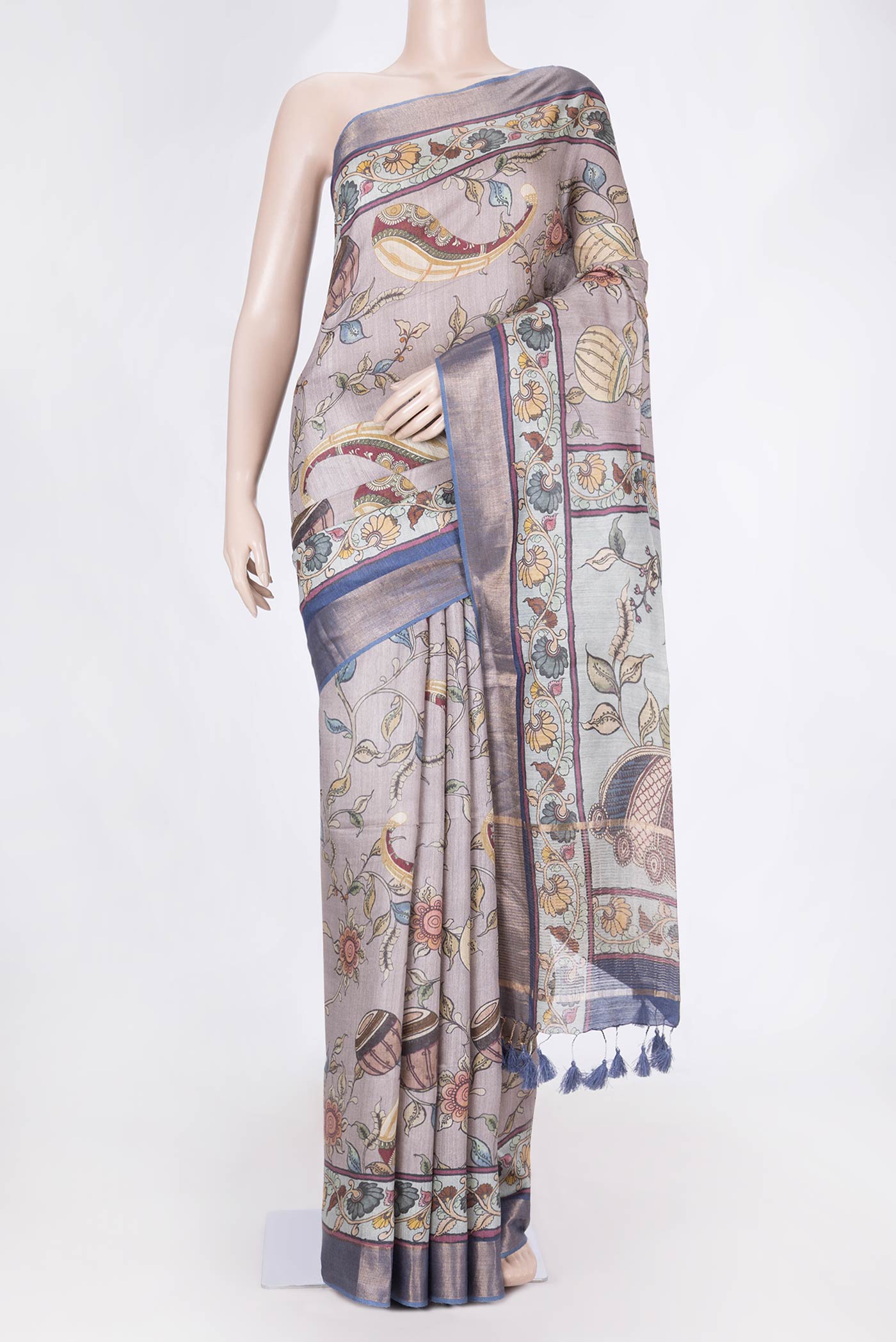 Grey Tussar Saree with Printed design on the body and Zari Border displayed on a mannequin