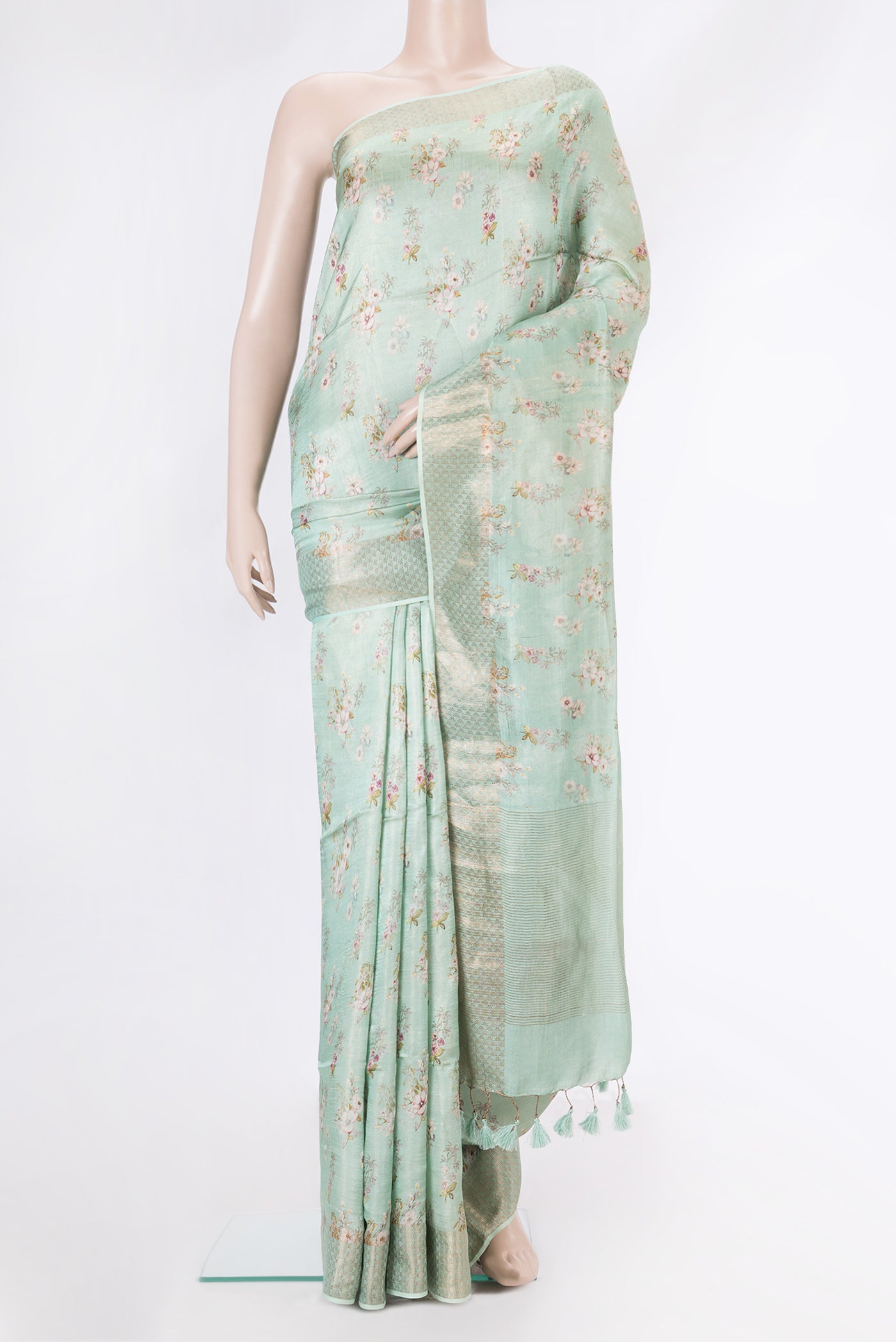 Sea Green Dual Tone Tussar Silk Saree with Printed design on the body and Zari Border.  displayed on a mannequin