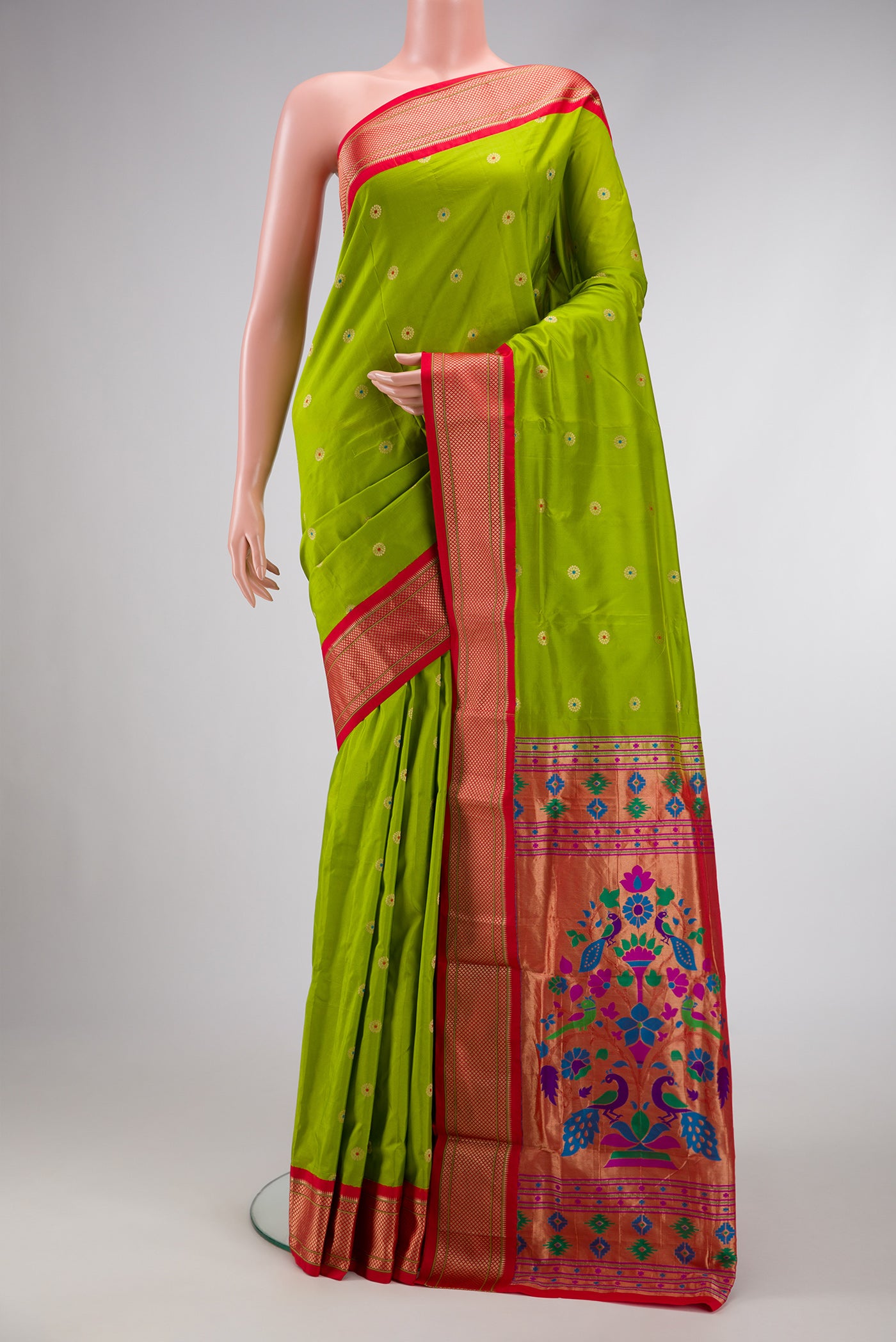 Parrot Green Dual Tone Paithani Silk Saree with Zari And Thread Butta on the body and Zari Border.  displayed on a mannequin