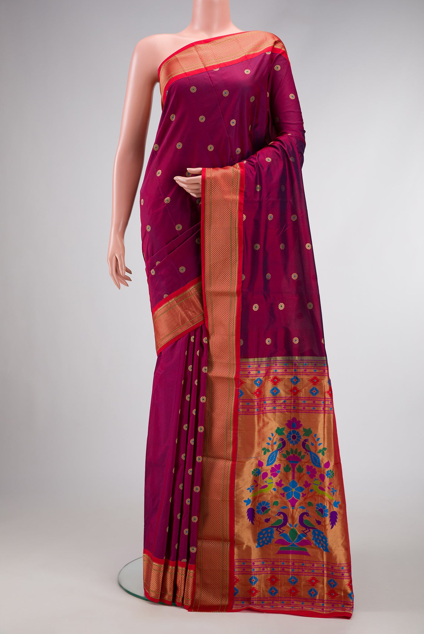 Maroon Dual Tone Paithani Silk Saree with Zari And Thread Butta on the body and Zari Border.  displayed on a mannequin