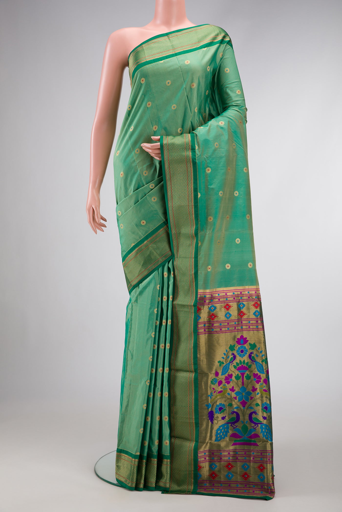 Light Green Dual Tone Paithani Silk Saree with Zari And Thread Butta on the body and Zari Border.  displayed on a mannequin