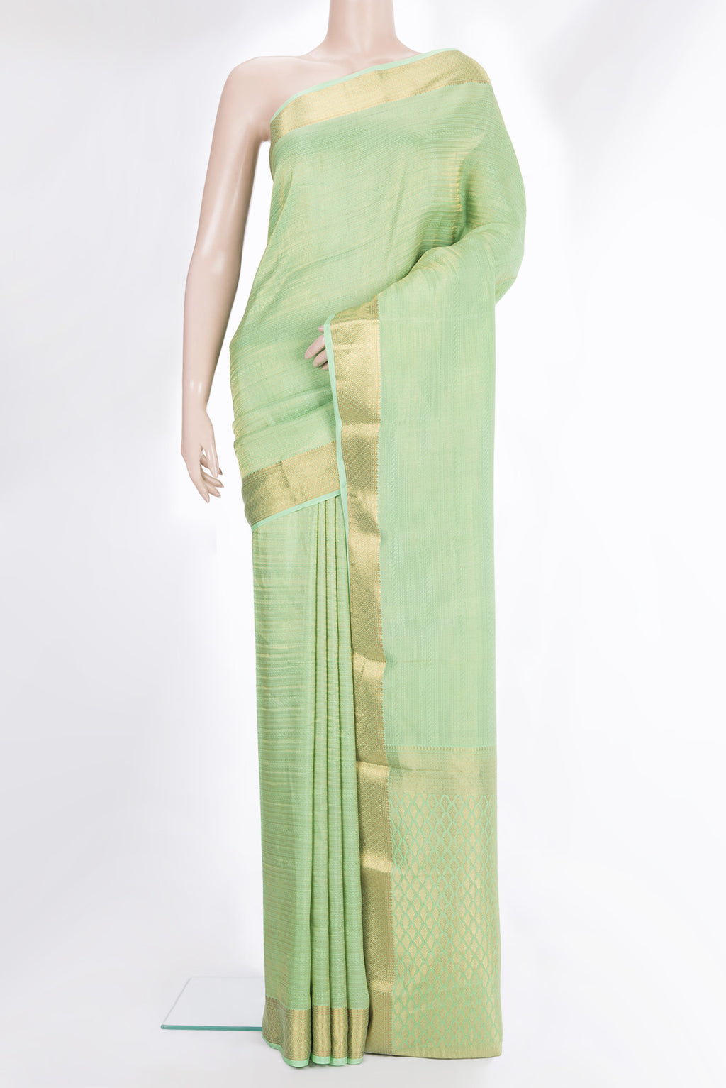 Pista Green Crepe Saree with Zari Brocade on the body and Zari Border.  displayed on a mannequin