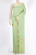 Pista Green Crepe Saree with Zari Brocade on the body and Zari Border.  displayed on a mannequin