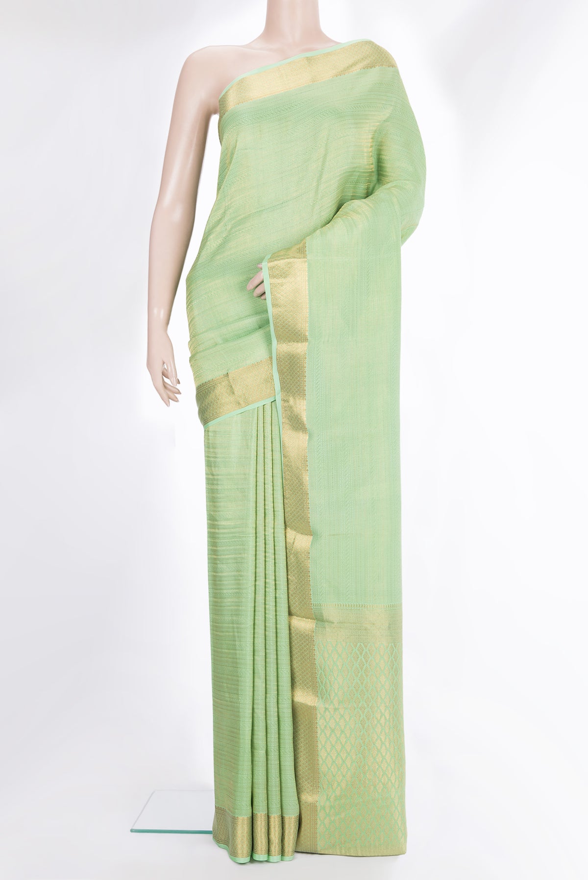 Pista Green Crepe Saree with Zari Brocade on the body and Zari Border.  displayed on a mannequin