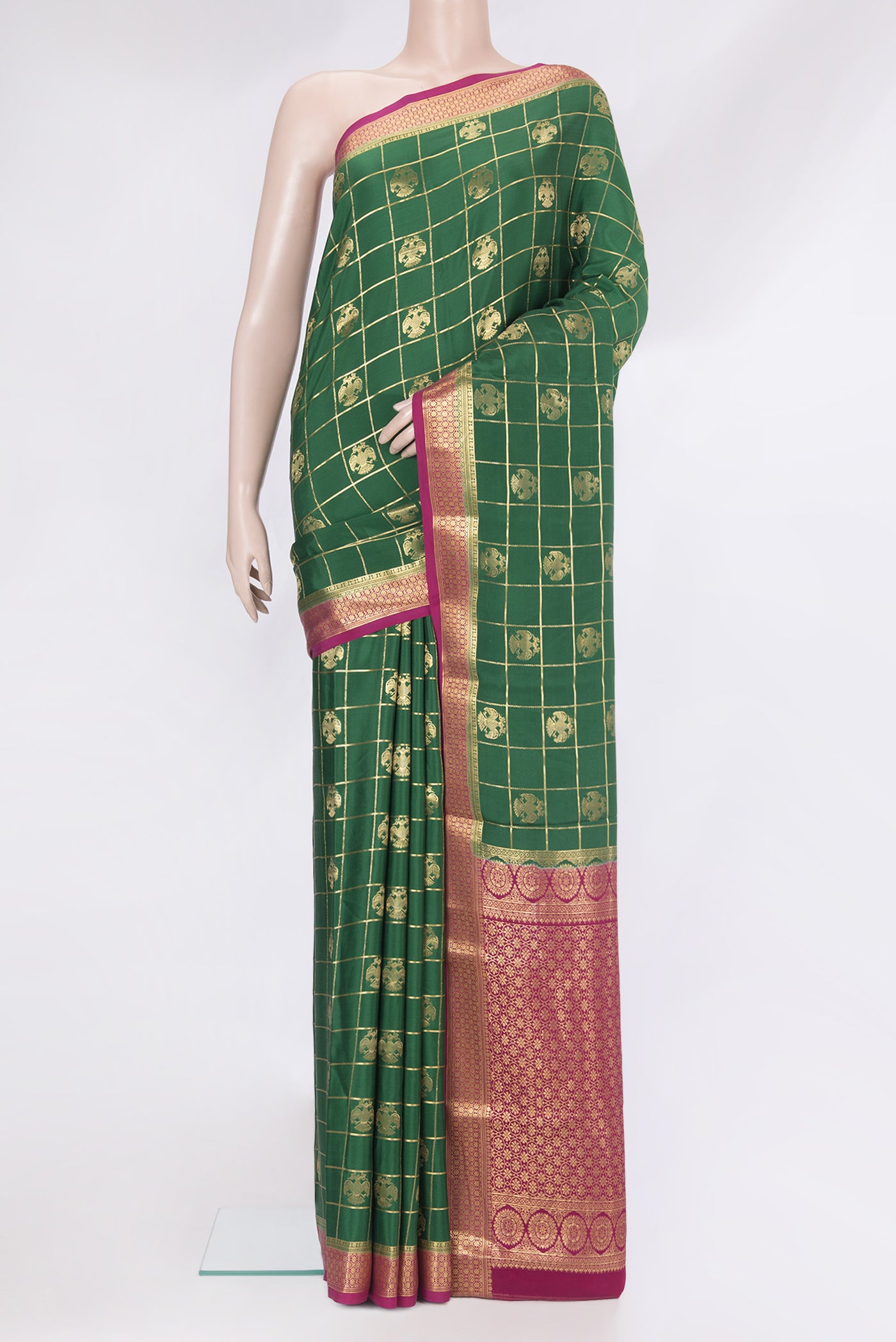 Green Mysore Silk Saree with Checked design on the body and Zari Border.  displayed on a mannequin