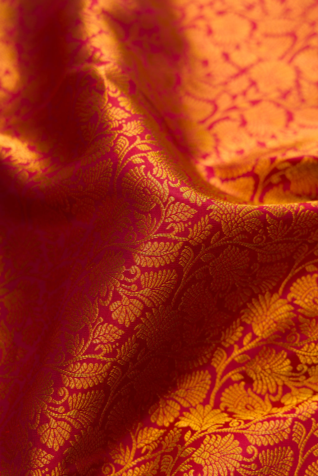Close up of Maroon Kanjivaram Silk Saree with Zari Brocade on the body and Zari Border.  displaying folds