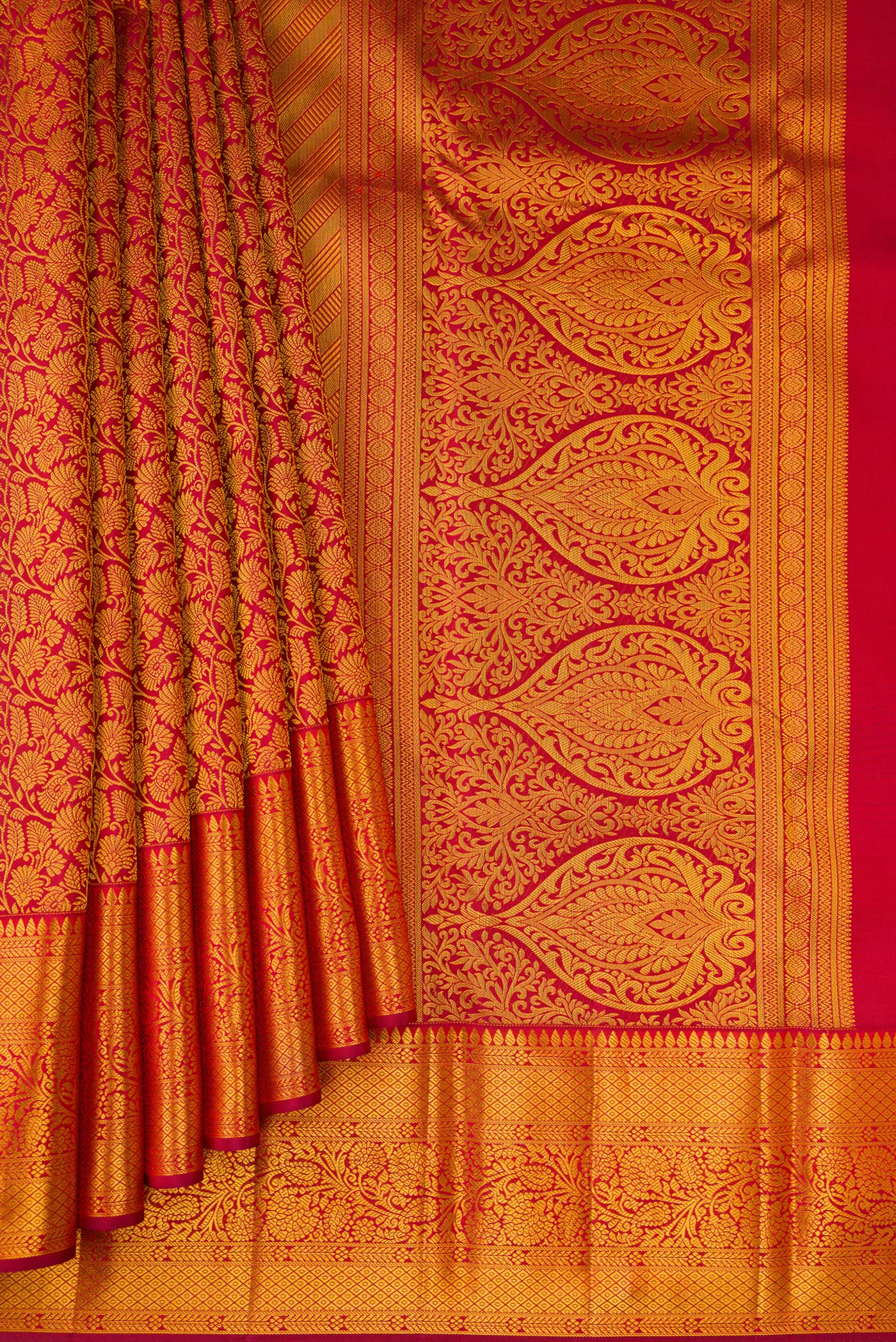 Pleats and pallu of Maroon Kanjivaram Silk Saree with Zari Brocade on the body and Zari Border. 