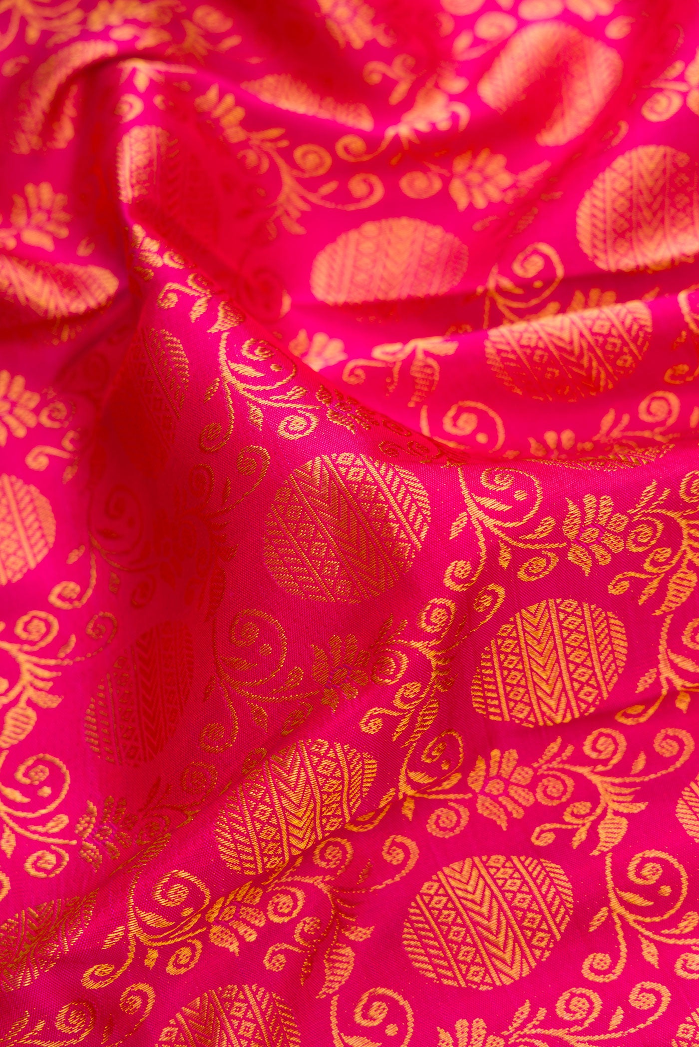 Close up of Pink Dual Tone Kanjivaram Silk Saree with Zari Brocade on the body and Zari Border.  displaying folds