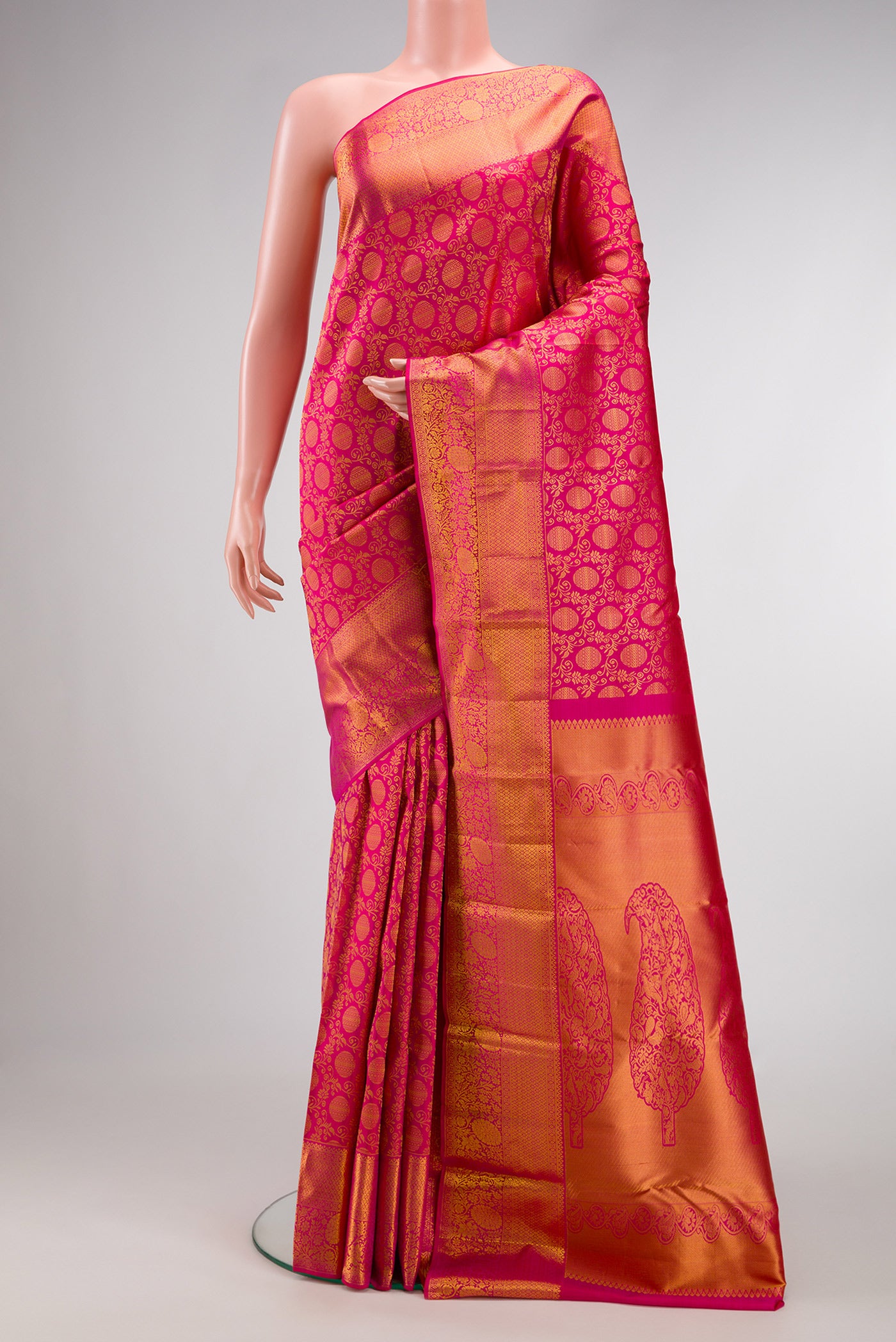Pink Dual Tone Kanjivaram Silk Saree with Zari Brocade on the body and Zari Border.  displayed on a mannequin