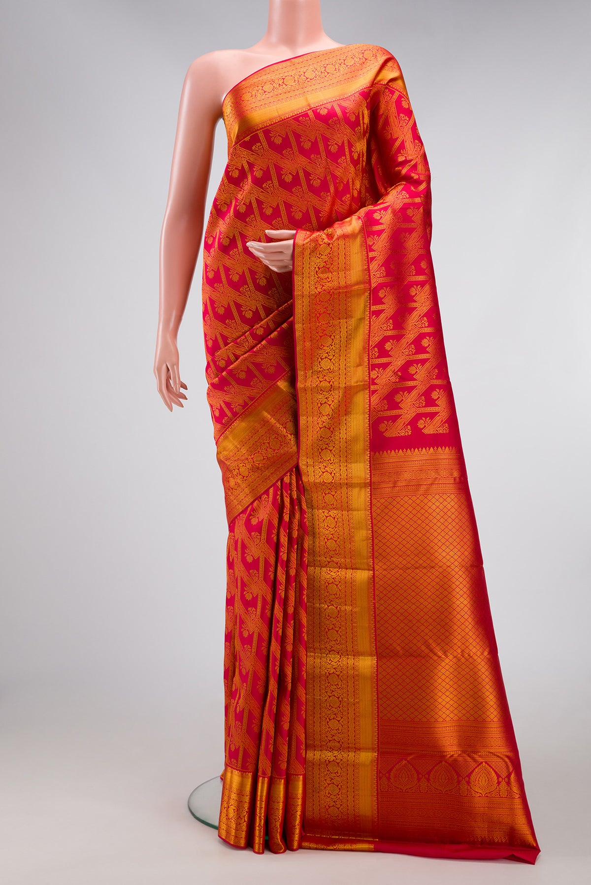 Dark Pink Dual Tone Kanjivaram Silk Saree with Zari Brocade on the body and Zari Border.  displayed on a mannequin