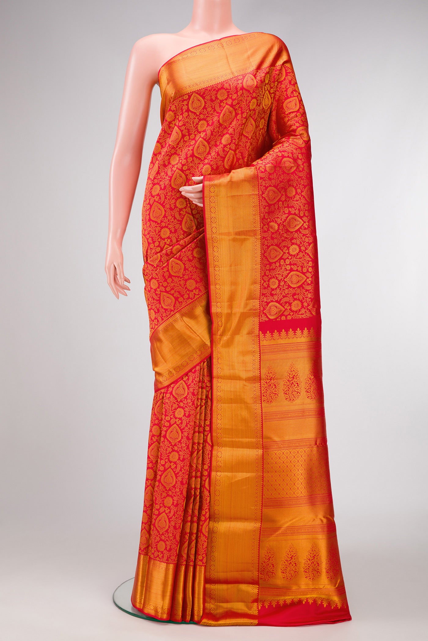 Red Dual Tone Kanjivaram Silk Saree with Zari Brocade on the body and Zari Border.  displayed on a mannequin