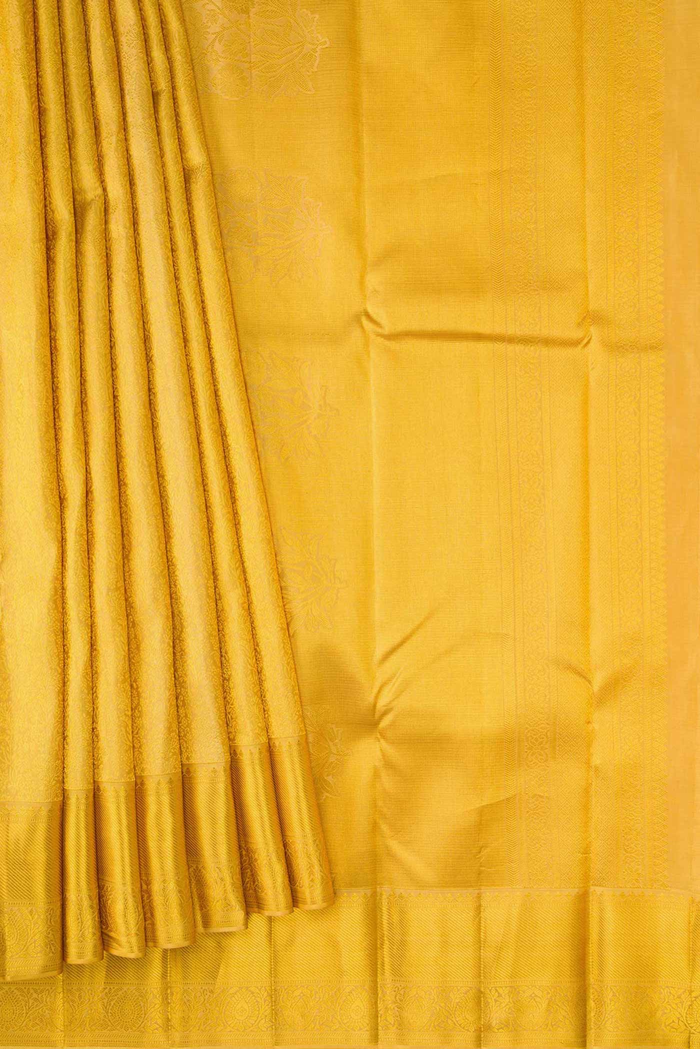 Pleats and pallu of Gold Dual Tone Kanjivaram Silk Saree with Zari Brocade on the body and Zari Border. 