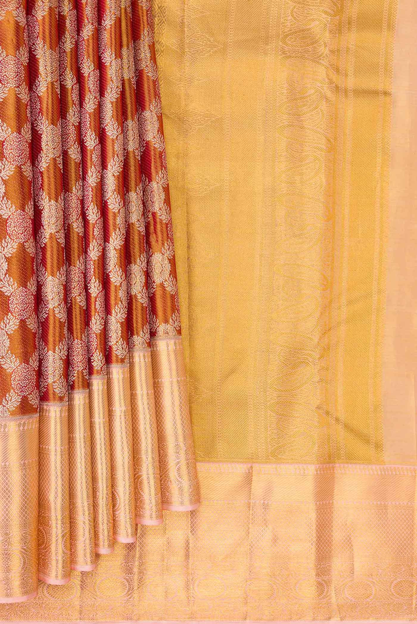 Pleats and pallu of Gold Dual Tone Kanchipuram Tissue Silk Saree with Zari Brocade on the body and Zari Border. 