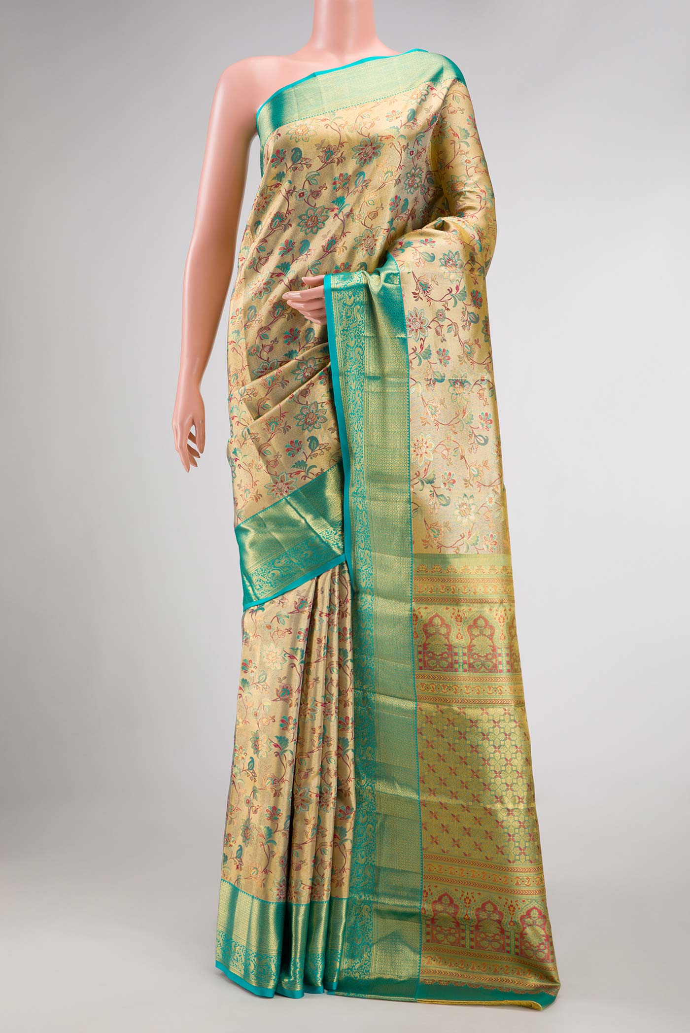 Gold Dual Tone Kanchipuram Tissue Silk Saree with Zari Brocade on the body and Zari Border.  displayed on a mannequin