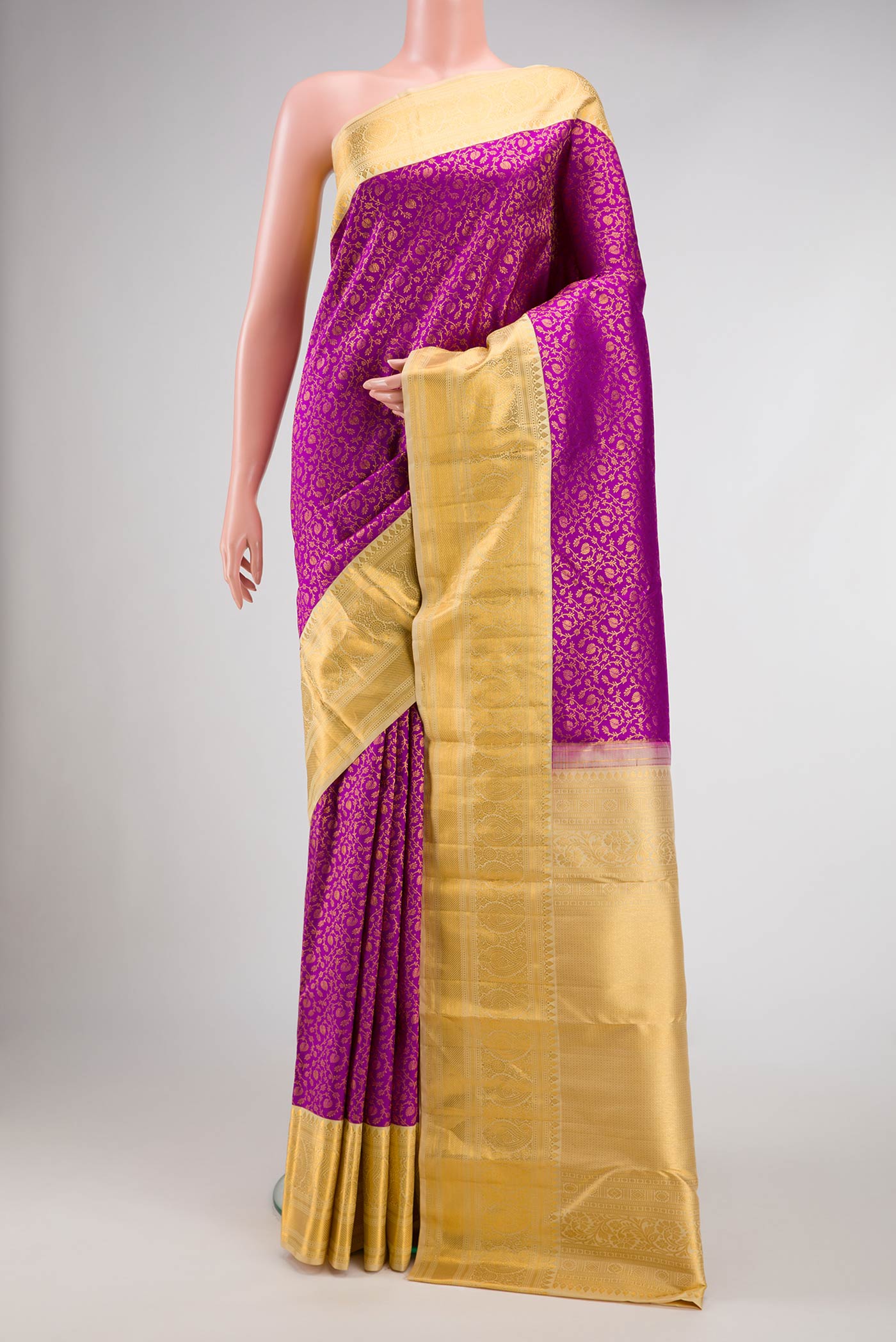 Magenta Dual Tone Kanchipuram Silk Saree with Zari Brocade on the body and Zari Border.  displayed on a mannequin