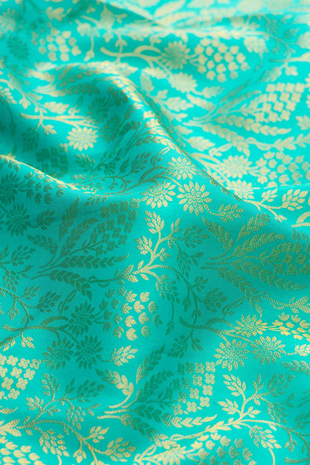 Close up of Sea Green Dual Tone Kanchipuram Silk Saree with Zari Brocade on the body and Zari Border.  displaying folds