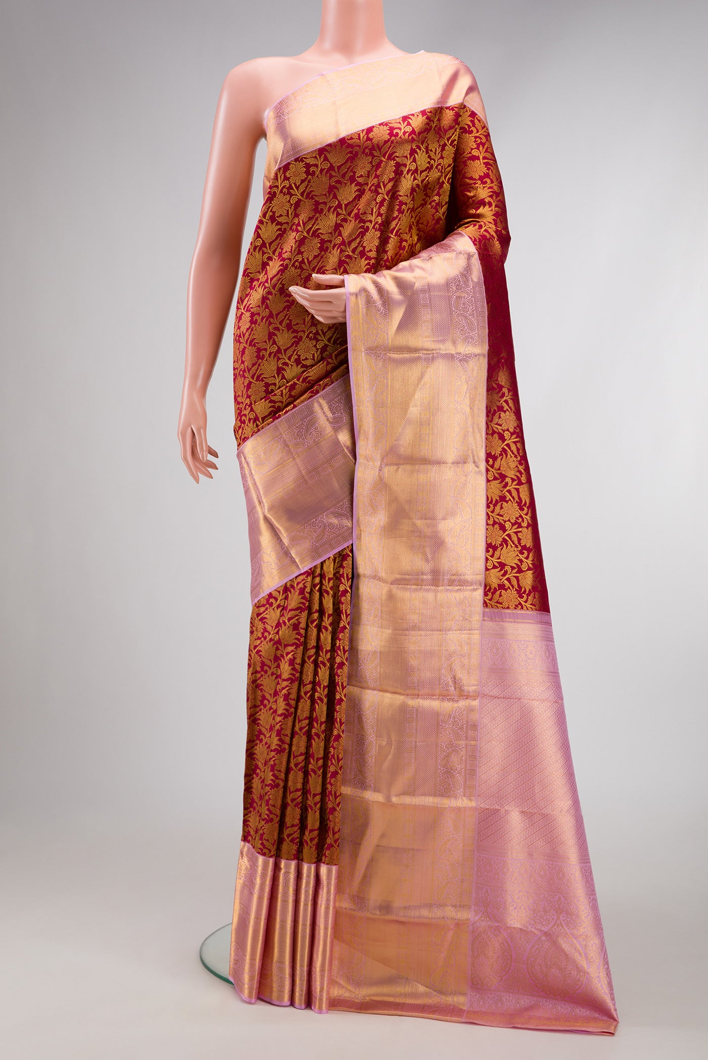 Maroon Dual Tone Kanchipuram Silk Saree with Zari Brocade on the body and Zari Border.  displayed on a mannequin