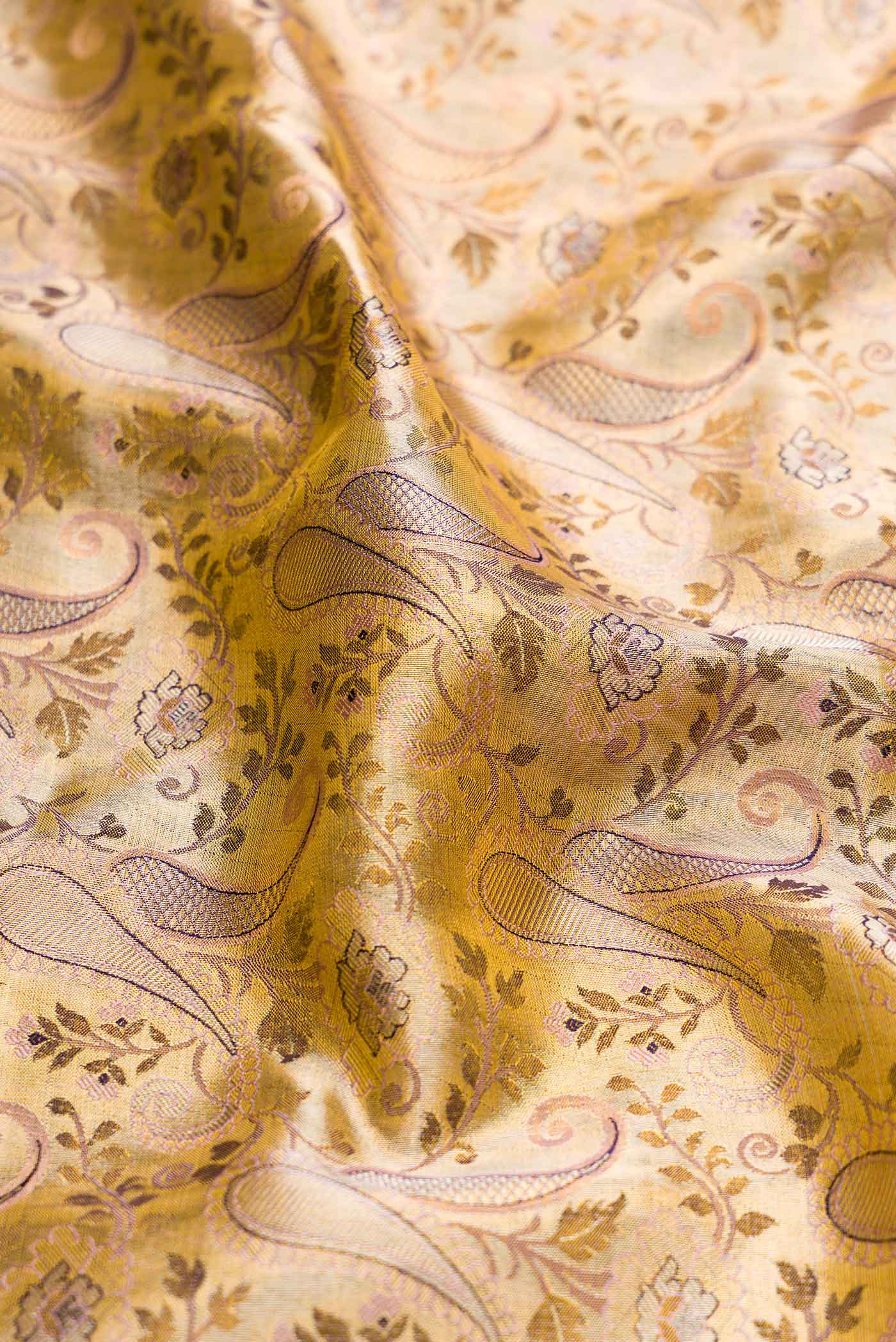 Close up of Gold Dual Tone Kanchipuram Silk Saree with Zari Brocade on the body and Fancy Border displaying folds