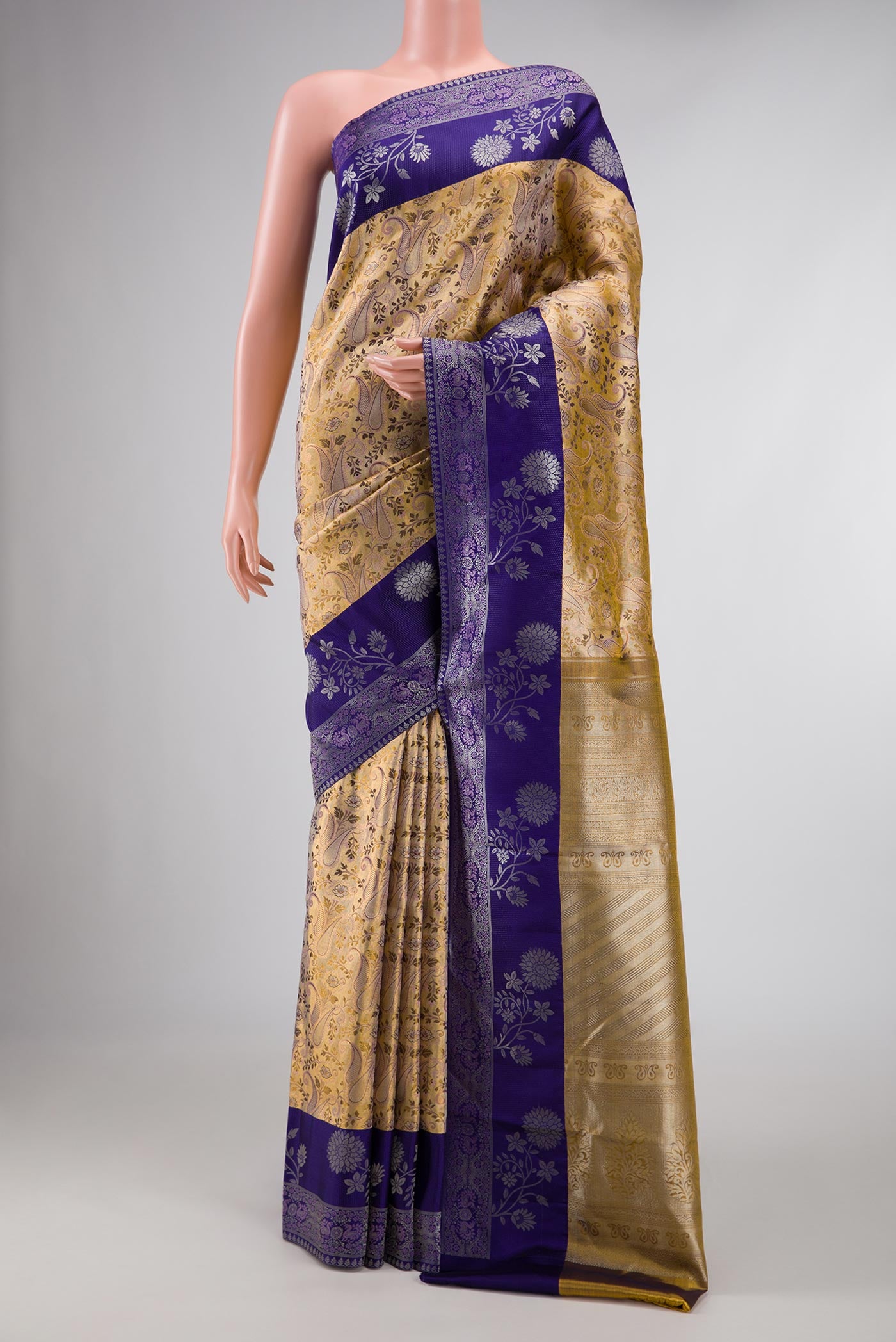 Gold Dual Tone Kanchipuram Silk Saree with Zari Brocade on the body and Fancy Border displayed on a mannequin