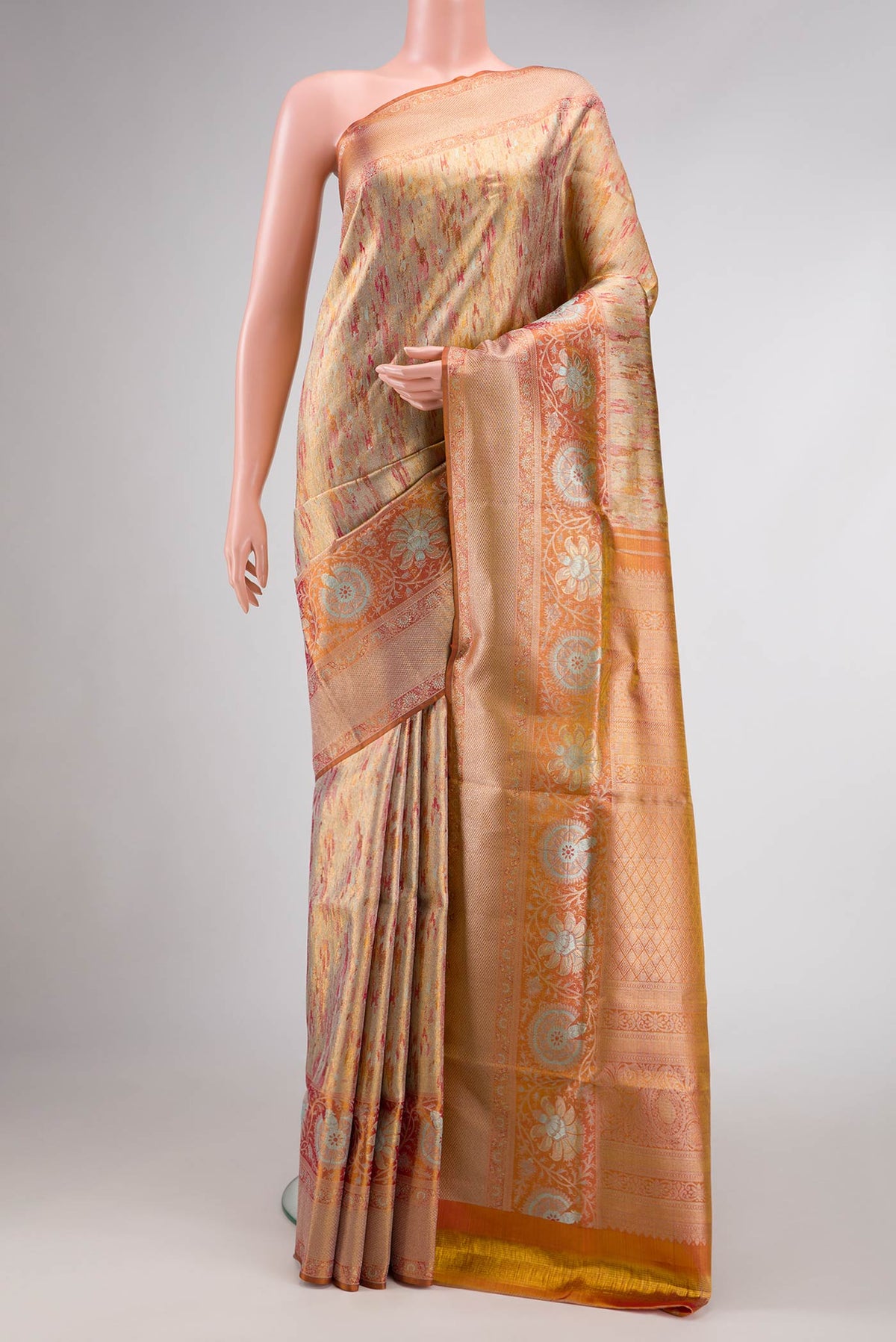 Gold Dual Tone Kanjivaram Tissue Silk Saree with Zari Brocade on the body and Zari Border.  displayed on a mannequin