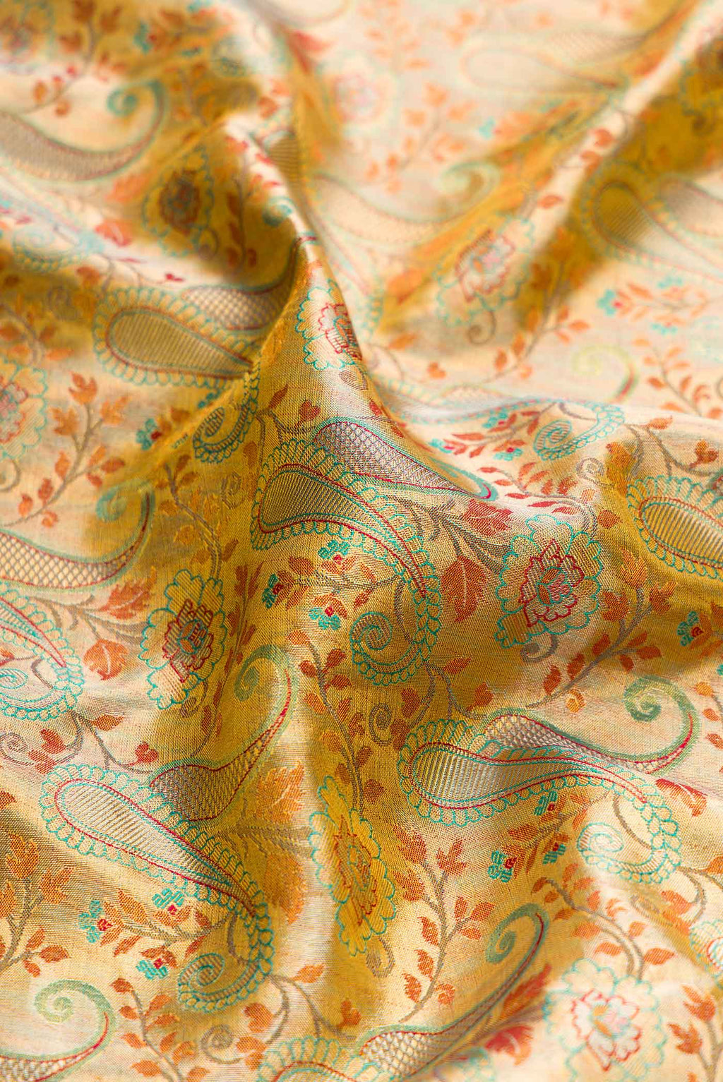 Close up of Gold Dual Tone Kanchipuram Silk Saree with Zari Brocade on the body and Fancy Border displaying folds