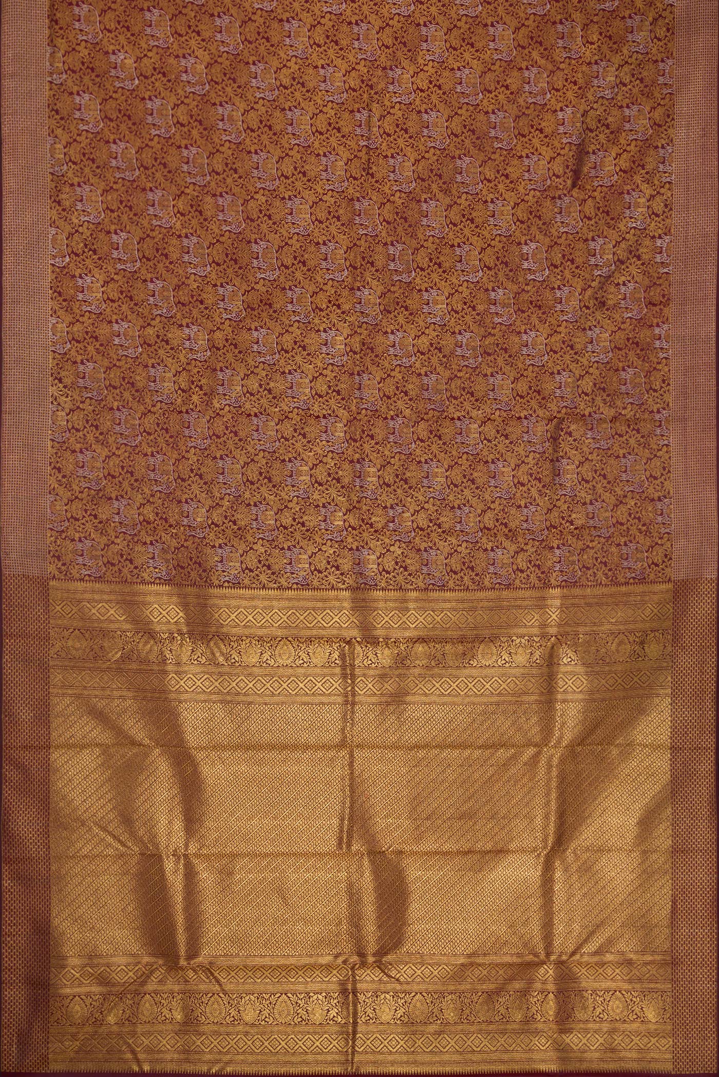 Flat view of Maroon Dual Tone Kanchipuram Silk Saree with Zari Brocade on the body and Zari Border. 