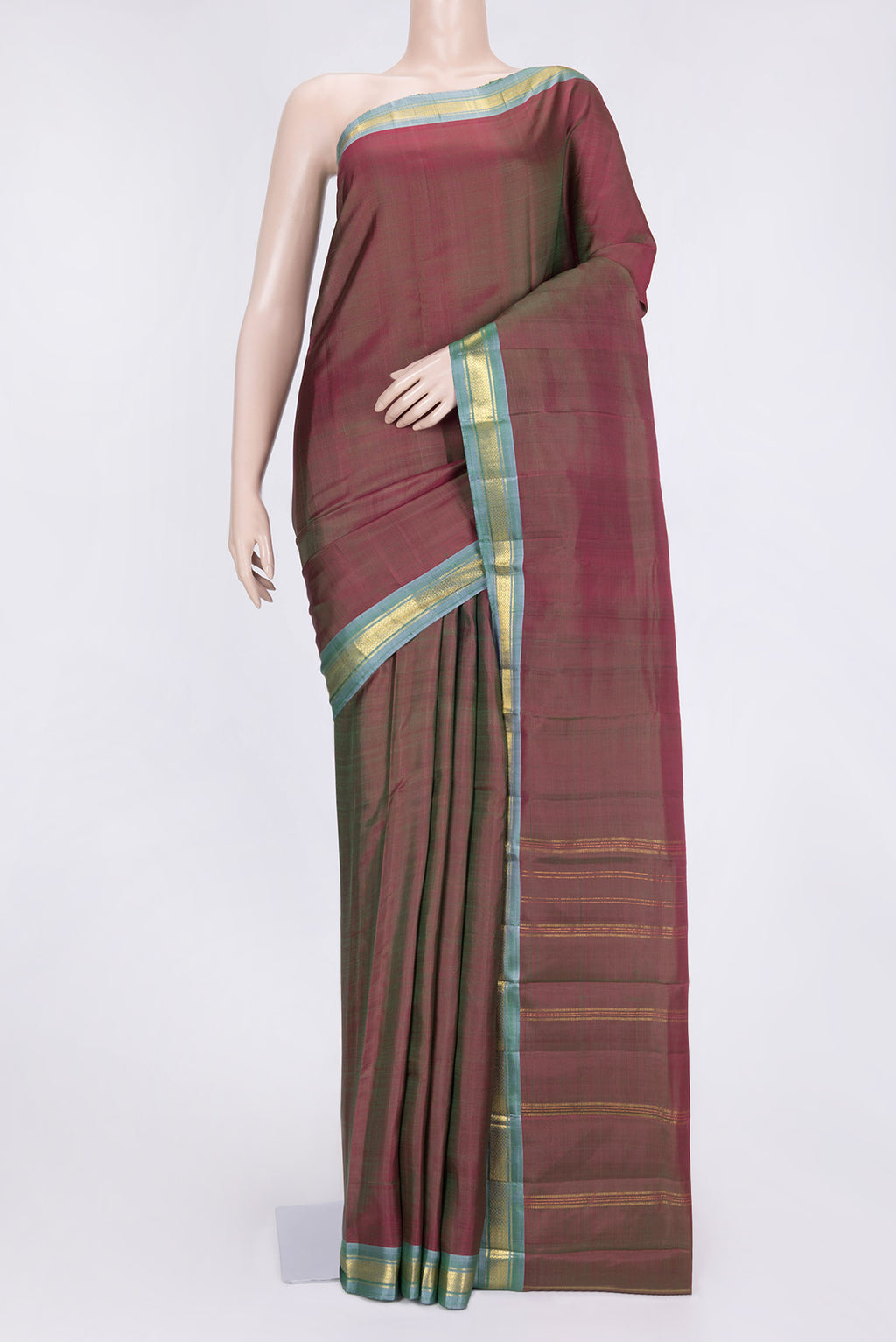 Mehandi Green Dual Tone Kanchipuram Saree with Plain Body and Zari Border.  displayed on a mannequin
