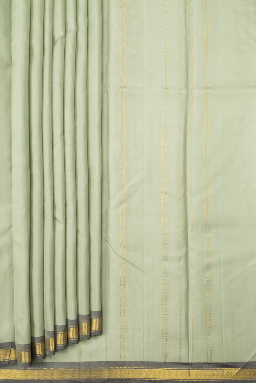 Pleats and pallu of Pista Green Dual Tone Kanchipuram Saree with Plain Body and Zari Border. 