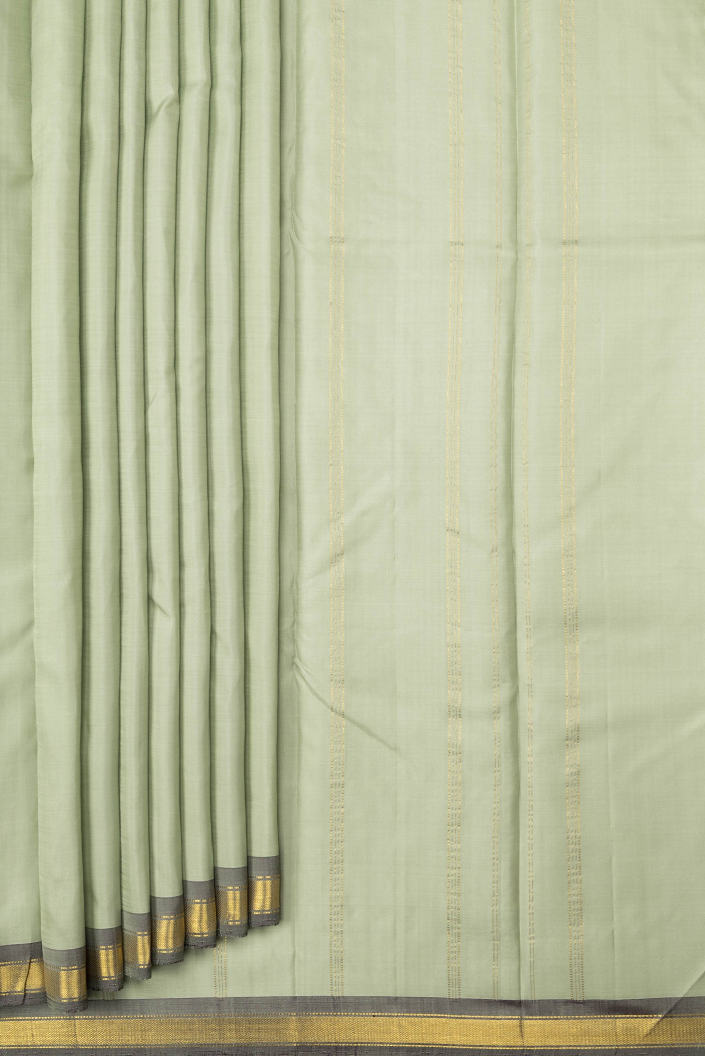 Pleats and pallu of Pista Green Dual Tone Kanchipuram Saree with Plain Body and Zari Border. 
