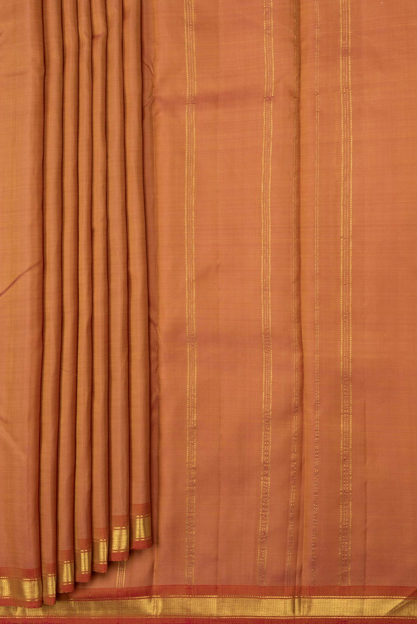 Pleats and pallu of Golden Peach Dual Tone Kanchipuram Saree with Plain Body and Zari Border. 