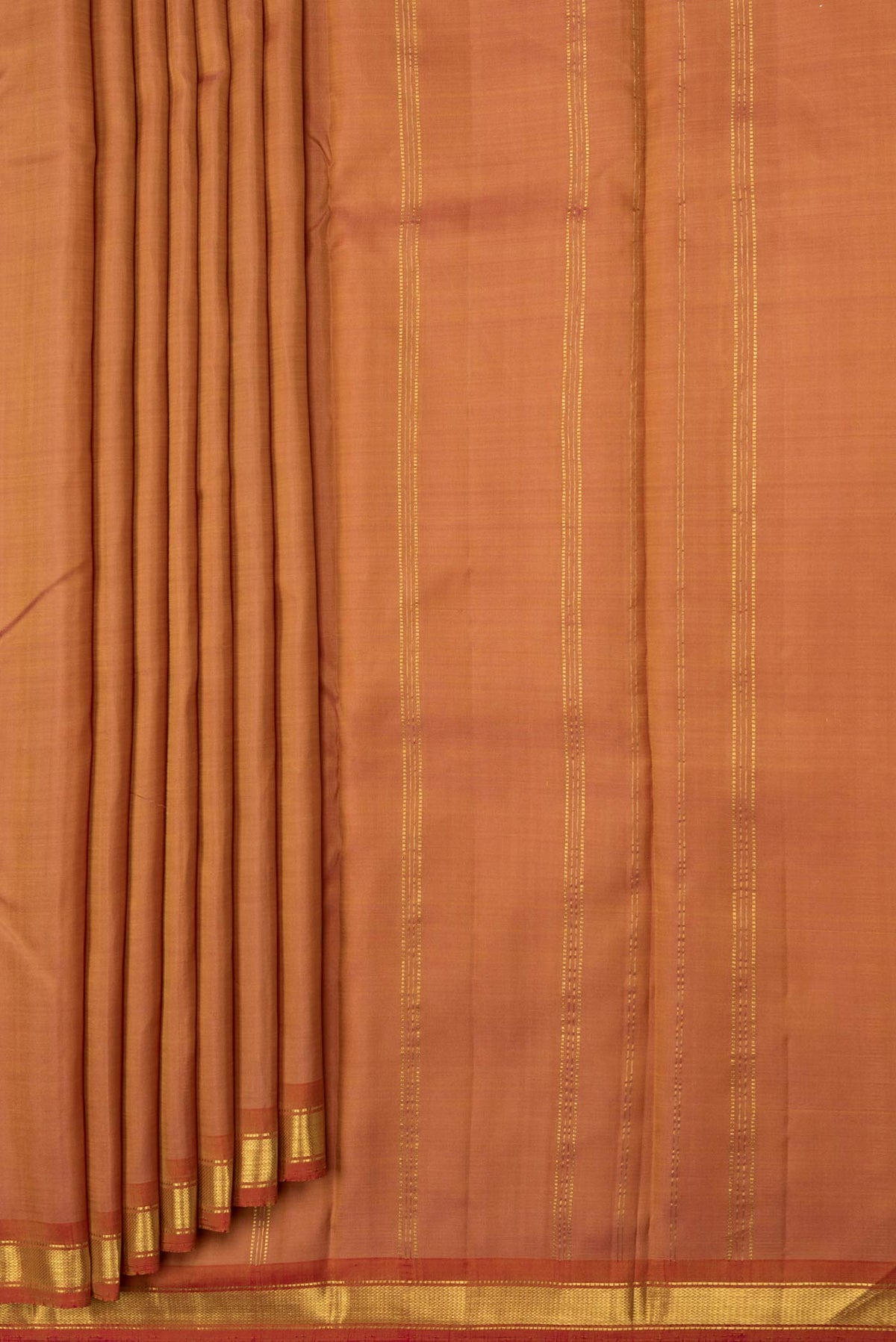 Pleats and pallu of Golden Peach Dual Tone Kanchipuram Saree with Plain Body and Zari Border. 