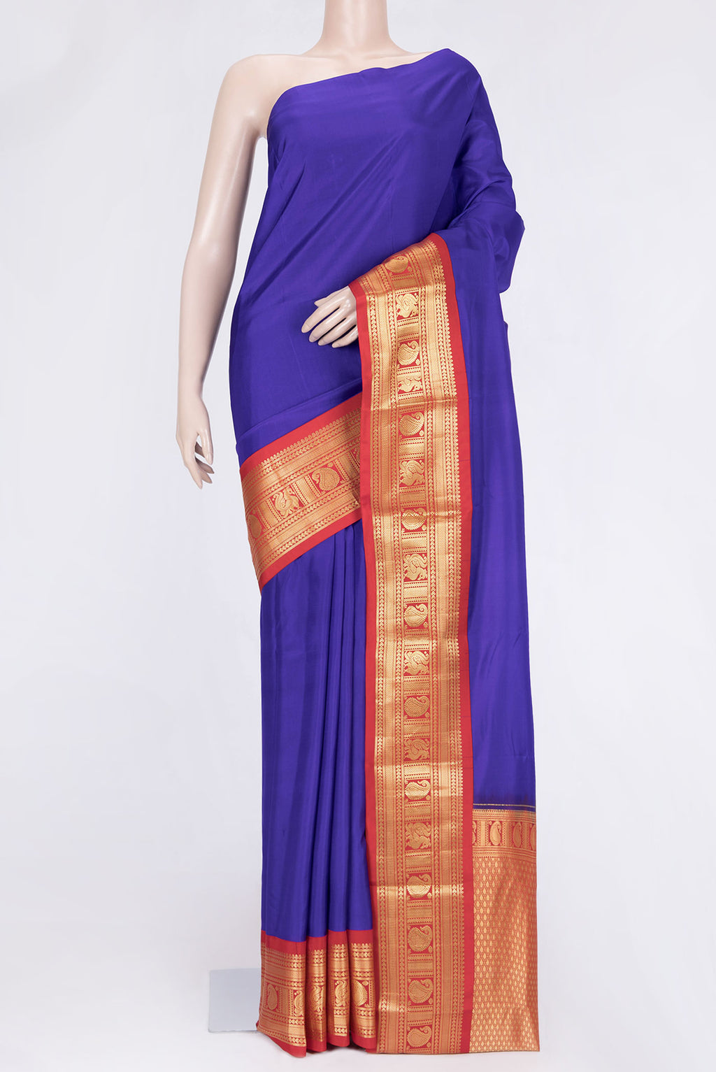 Royal Blue Dual Tone Kanchipuram Saree with Plain Body and Zari Border.  displayed on a mannequin