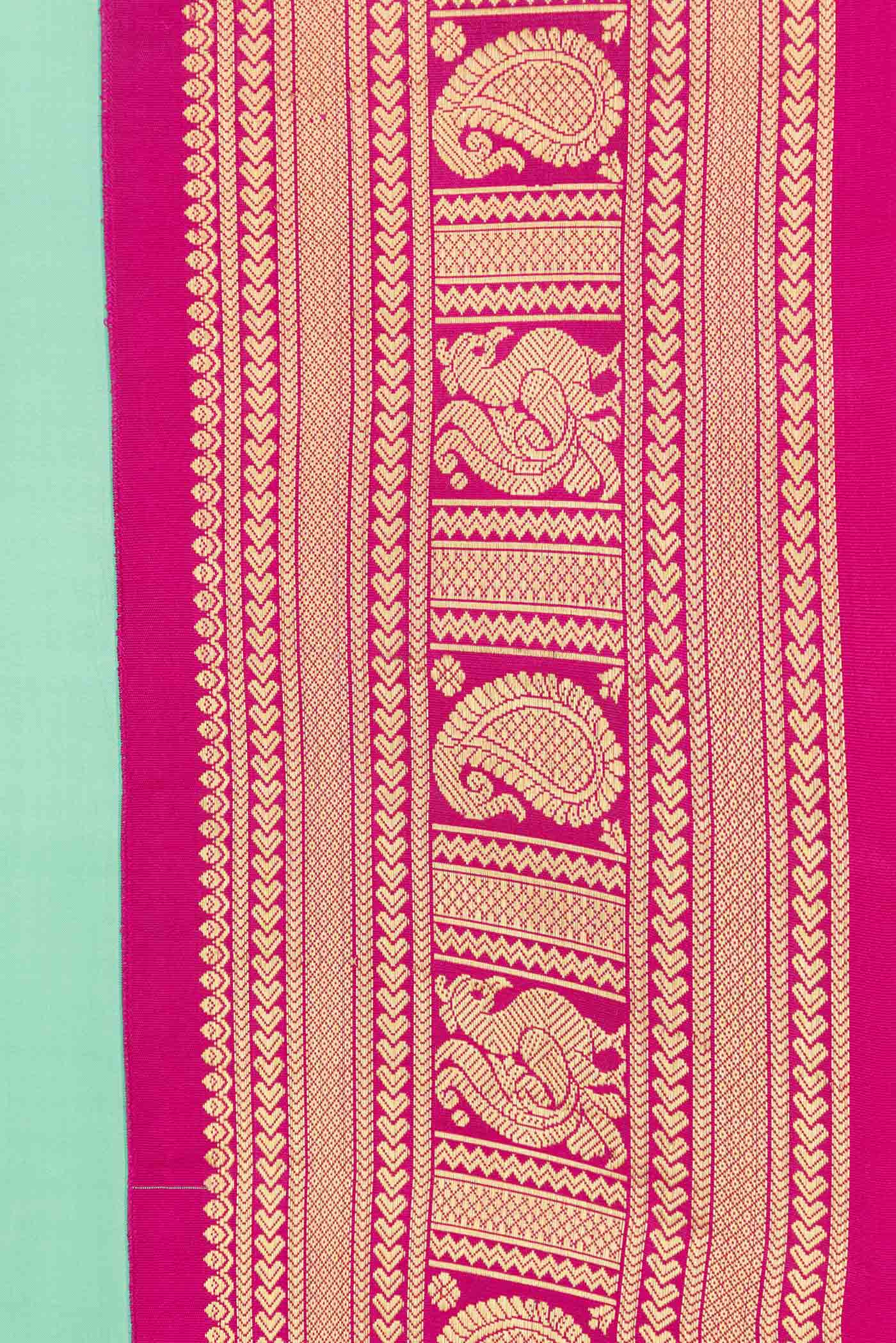 Border image of Pista Green Dual Tone Kanchipuram Saree with Plain Body and Zari Border. 