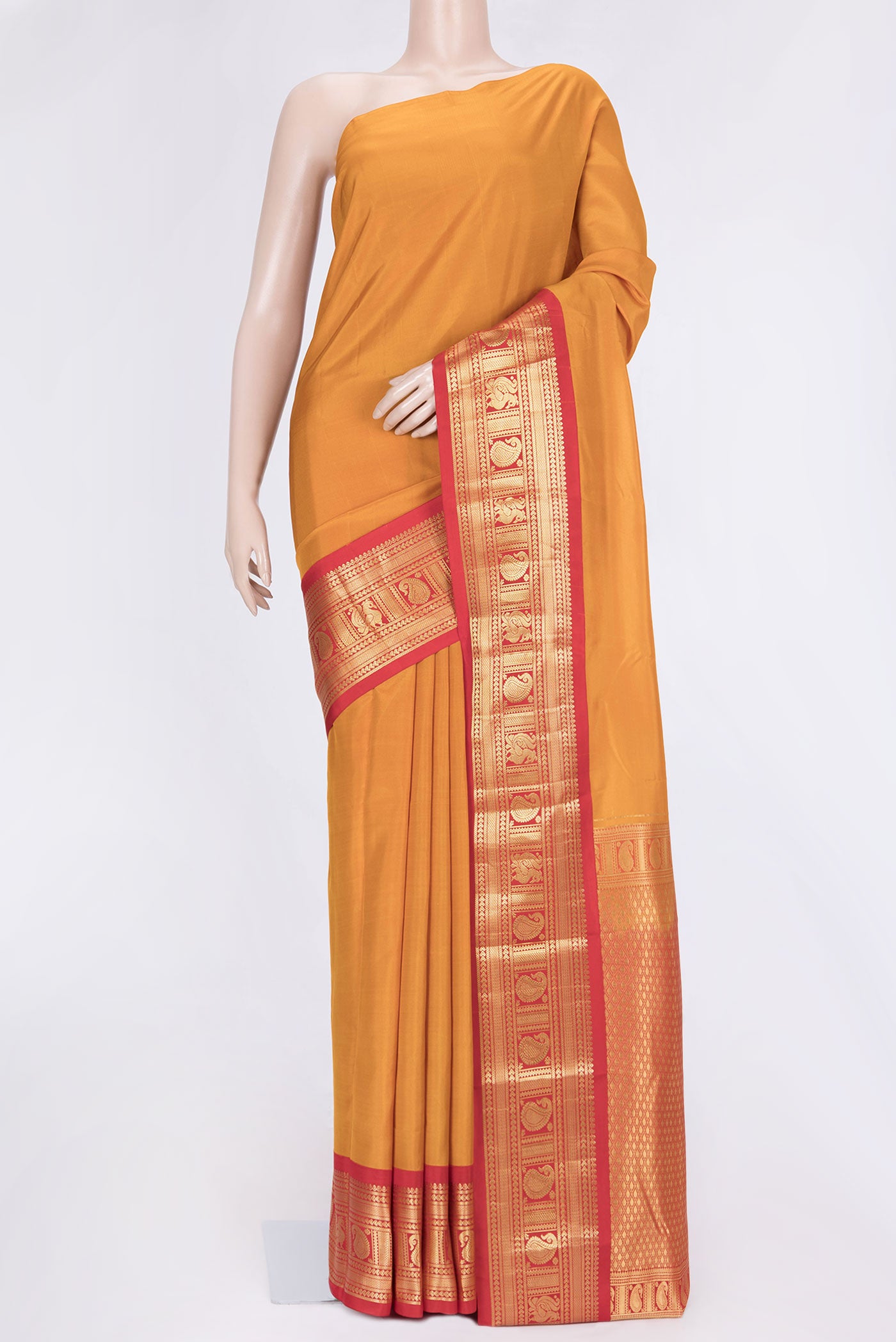 Mustard Dual Tone Kanchipuram Saree with Plain Body and Zari Border.  displayed on a mannequin