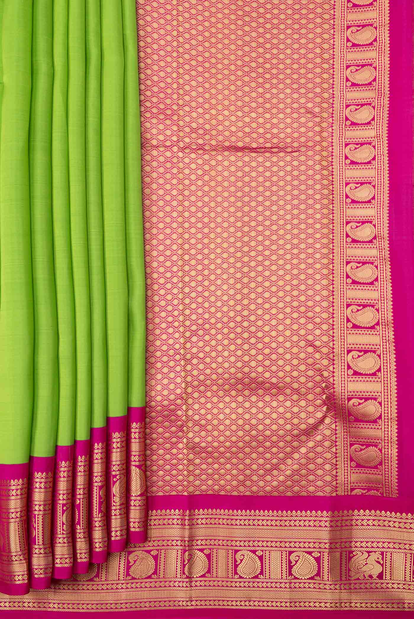 Pleats and pallu of Parrot Green Dual Tone Kanchipuram Saree with Plain Body and Zari Border. 