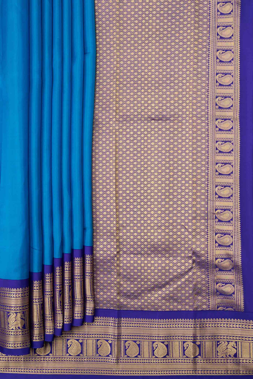 Pleats and pallu of Peacock Blue Dual Tone Kanchipuram Saree with Plain Body and Zari Border. 
