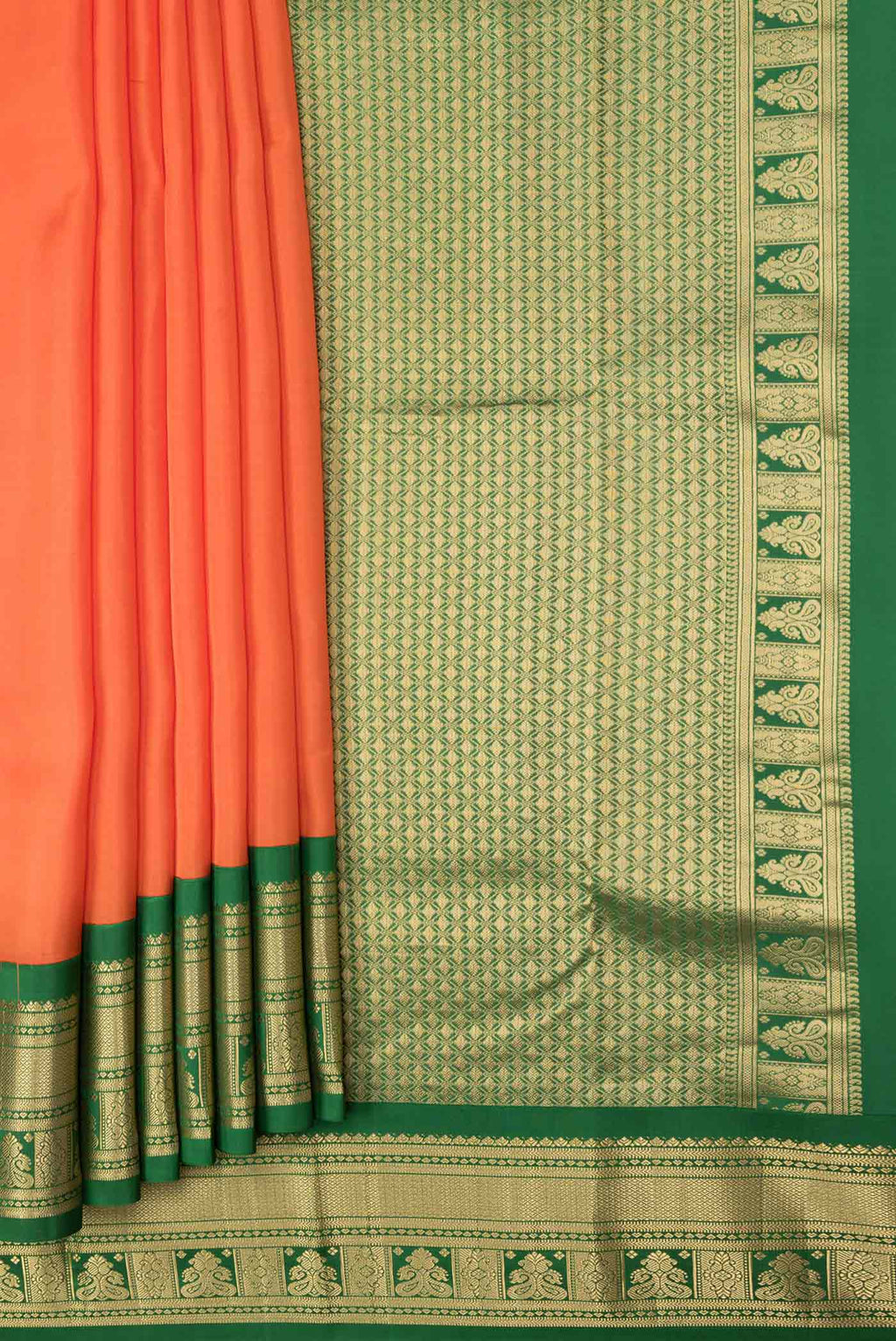 Pleats and pallu of Orange Dual Tone Kanchipuram Saree with Plain Body and Zari Border. 