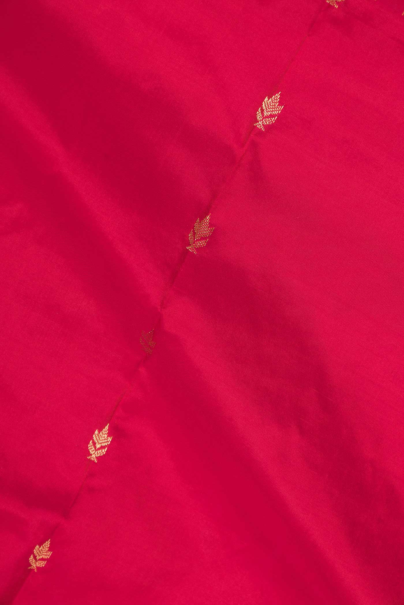 Close up of Pink Bangalore Silk Saree with Zari Butta on the body and Zari Border displaying folds