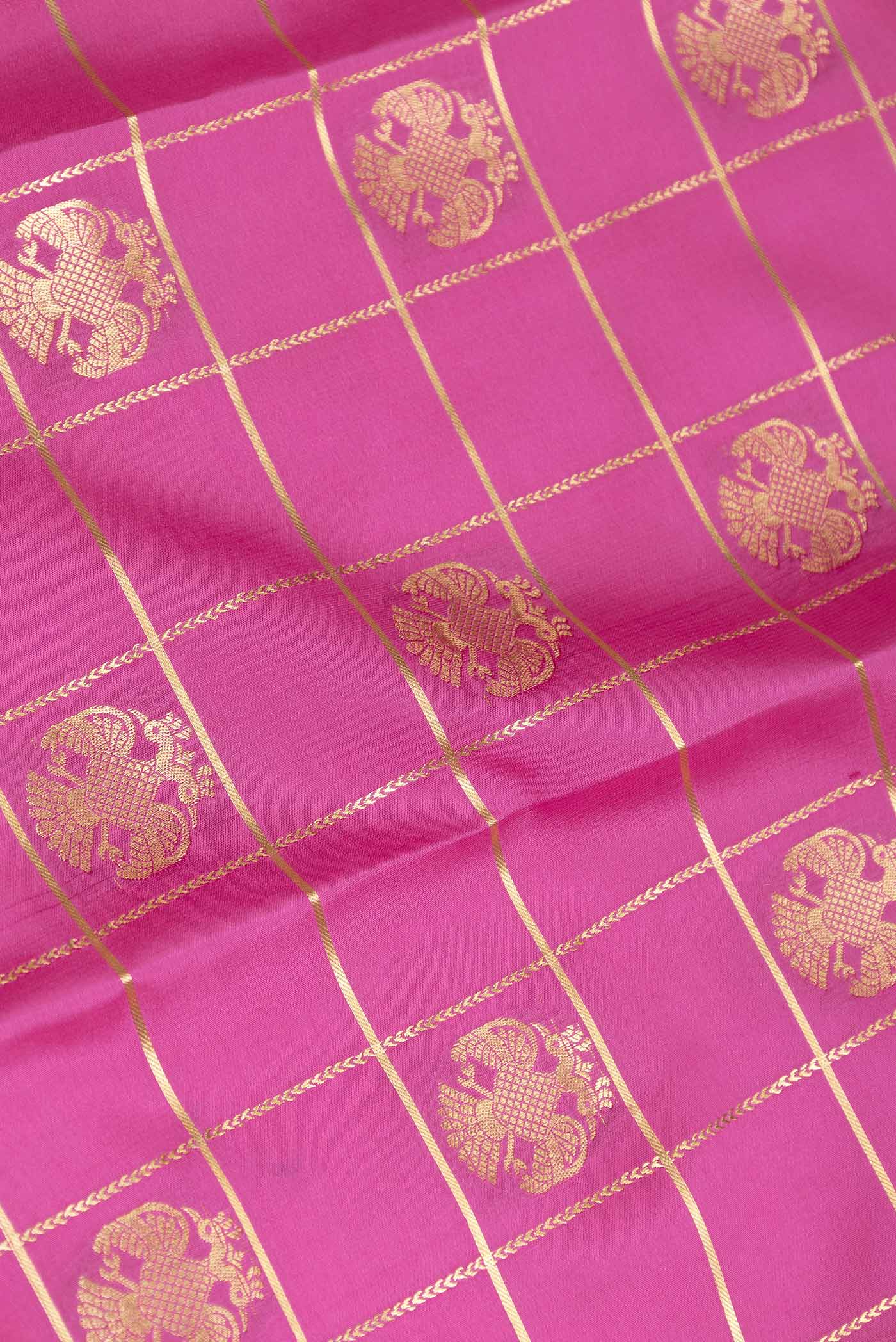 Close up of Pink Dual Tone Mysore Crepe Saree with Checked design on the body and Zari Border displaying folds