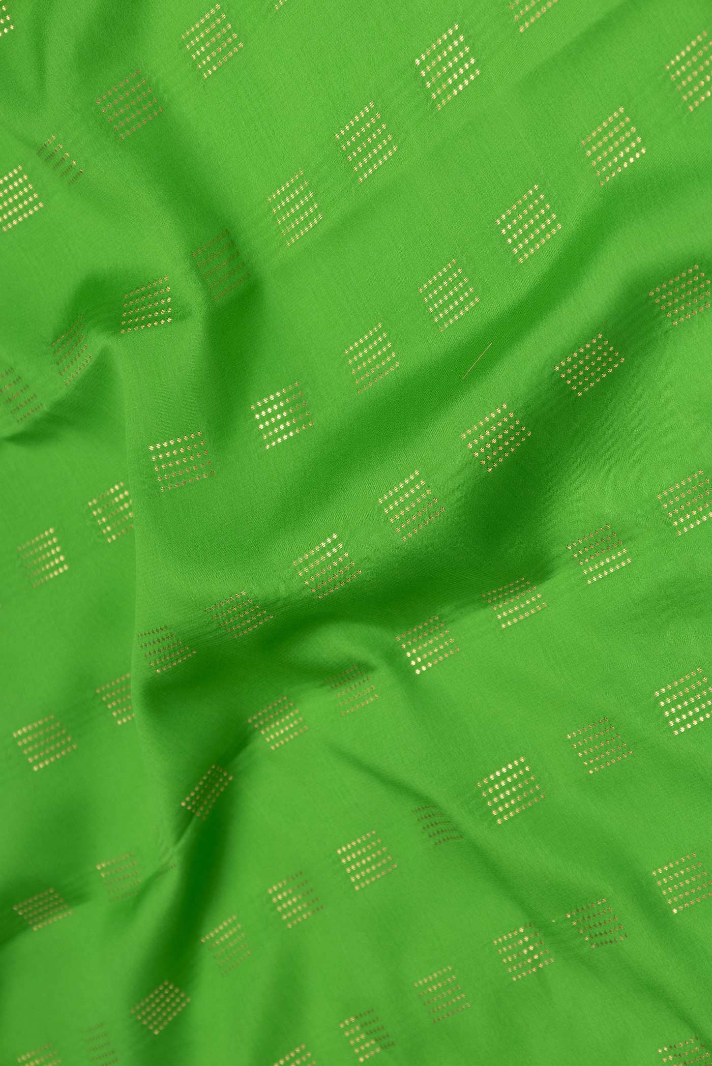 Close up of Green Dual Tone Mysore Crepe Saree with Zari Butta on the body and Zari Border displaying folds