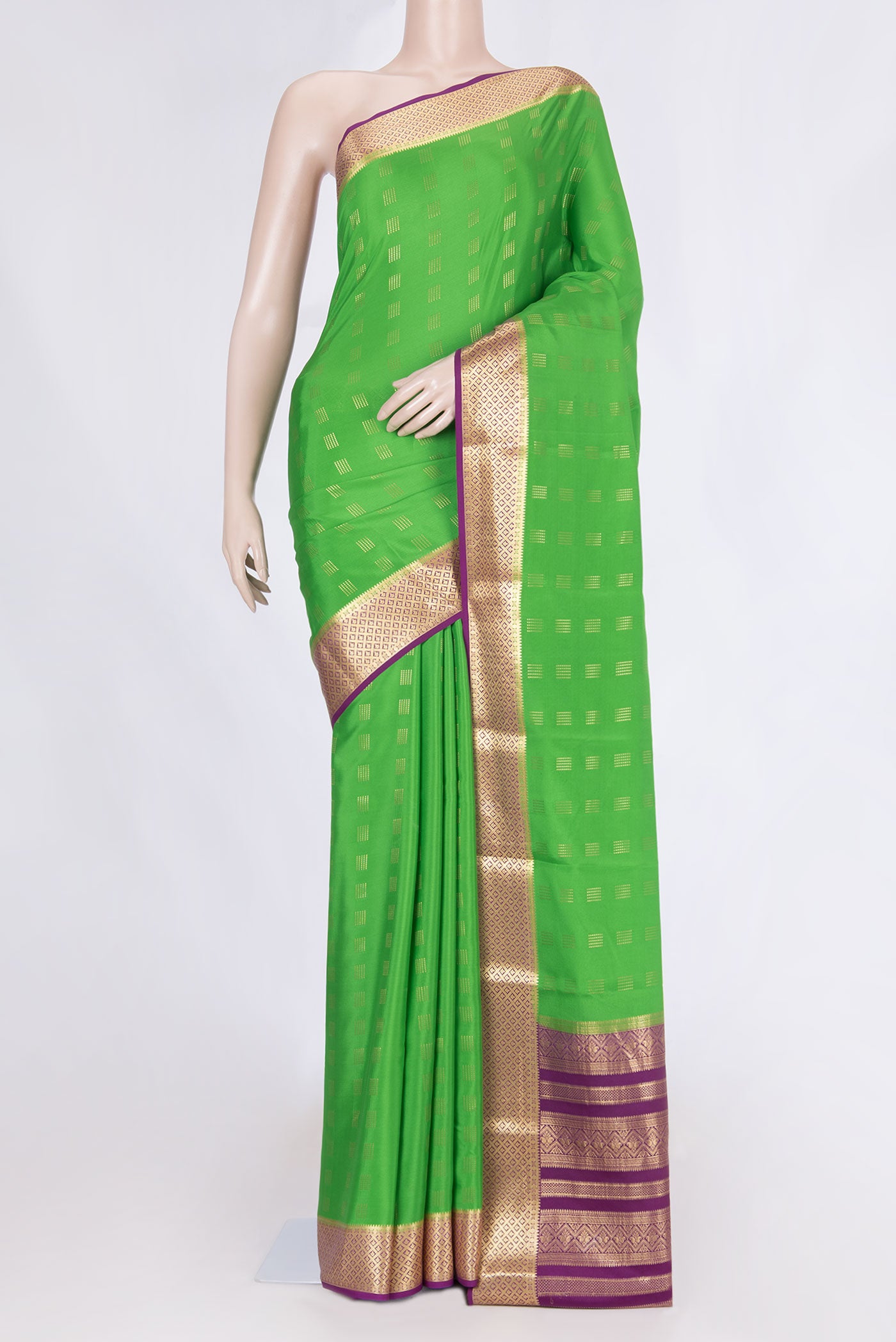 Green Dual Tone Mysore Crepe Saree with Zari Butta on the body and Zari Border displayed on a mannequin