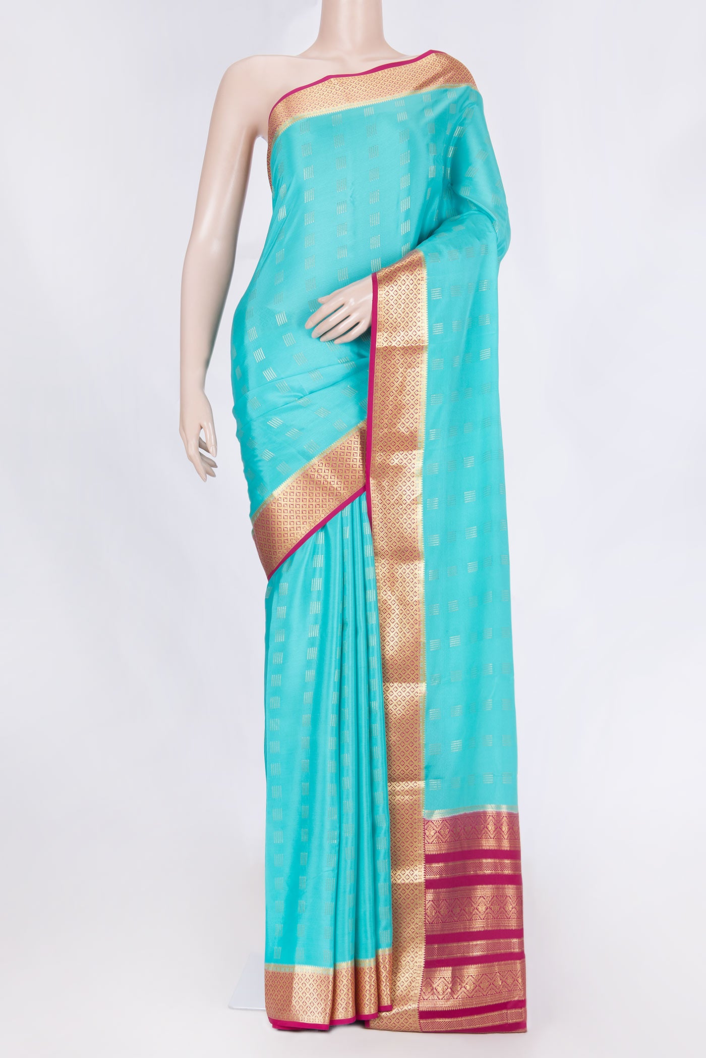 Sky Blue Dual Tone Mysore Crepe Saree with Zari Butta on the body and Zari Border displayed on a mannequin