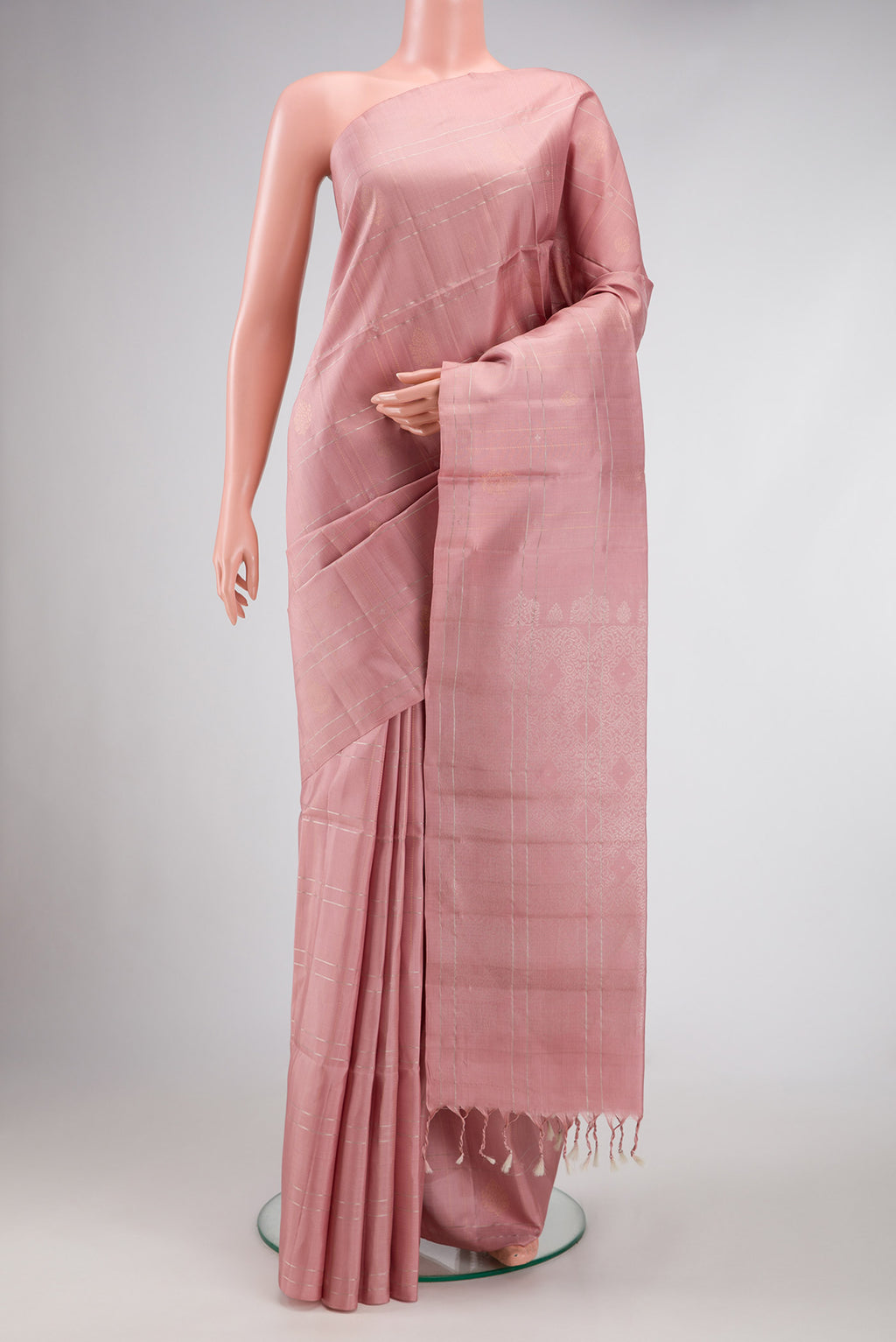 Rose Gold Dual Tone Soft Silk Saree with Checked design on the body and Without Border.  displayed on a mannequin