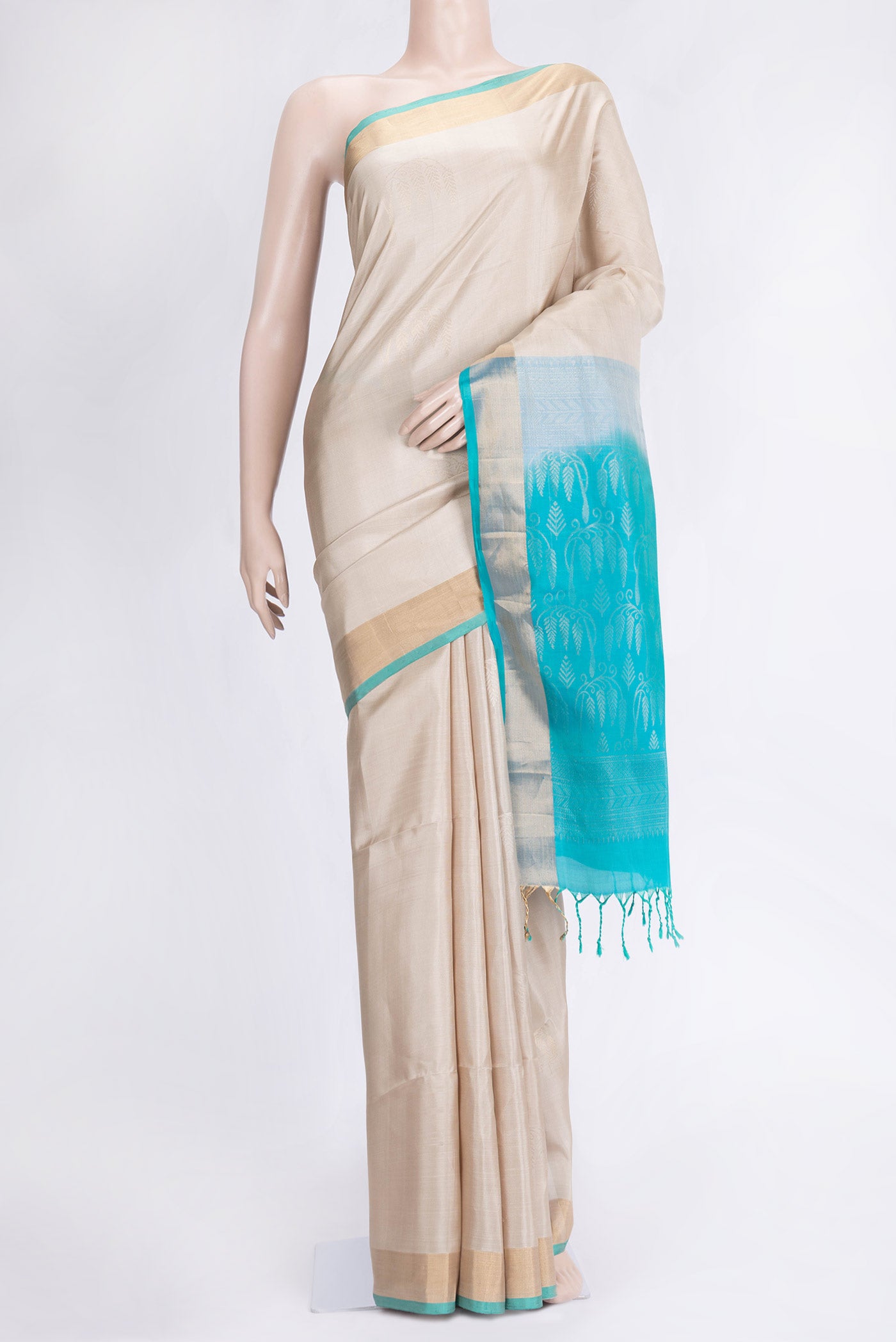 Beige Dual Tone Soft Silk Saree with Zari Butta on the body and Zari Border.  displayed on a mannequin